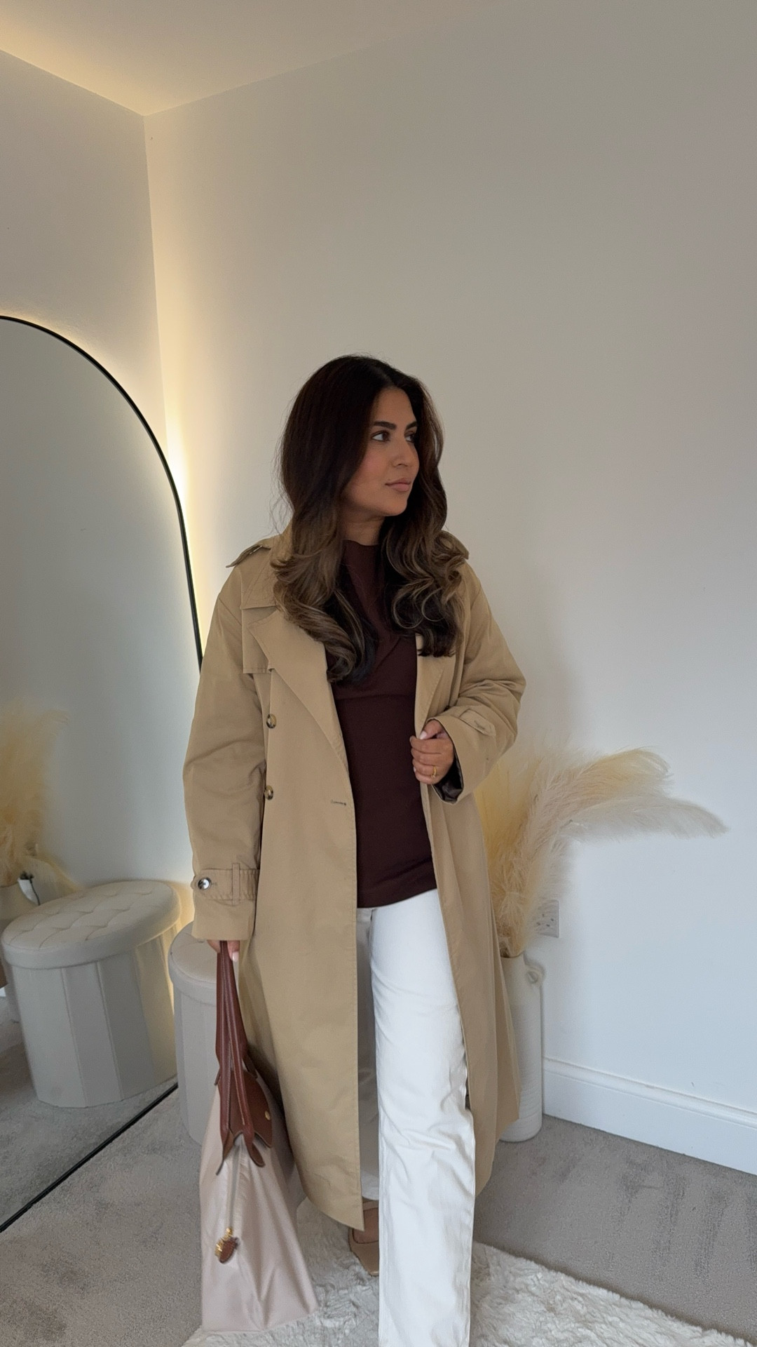 Trench coat, brown H&M top white jeans autumn fall modest outfit ideas #LTKfashionweek 

#LTKmodest #LTKFashionMonth #LTKautumn