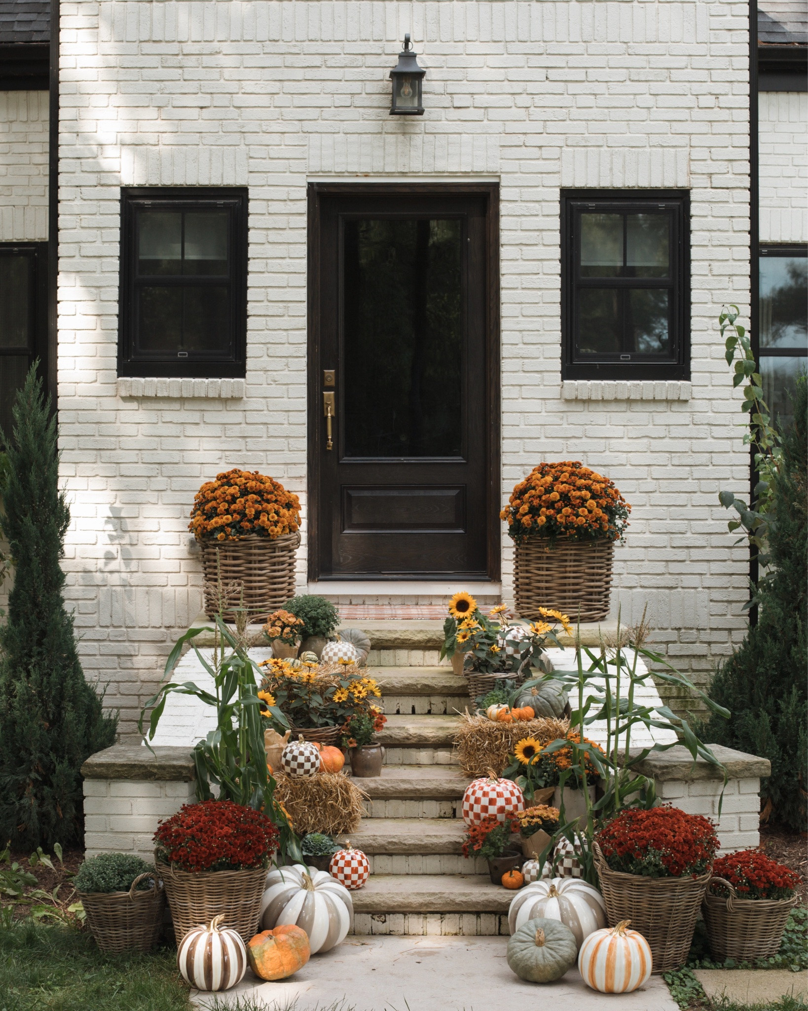 Our final porch 🥹 when I saw the new MacKenzie-Childs pumpkins I knew exactly where they needed to be! They are my favorite detail in this years fall porch and add the perfect pop of color & pattern. Comment ‘details’ and I’ll send you links! @mackenziechilds #mcpartner