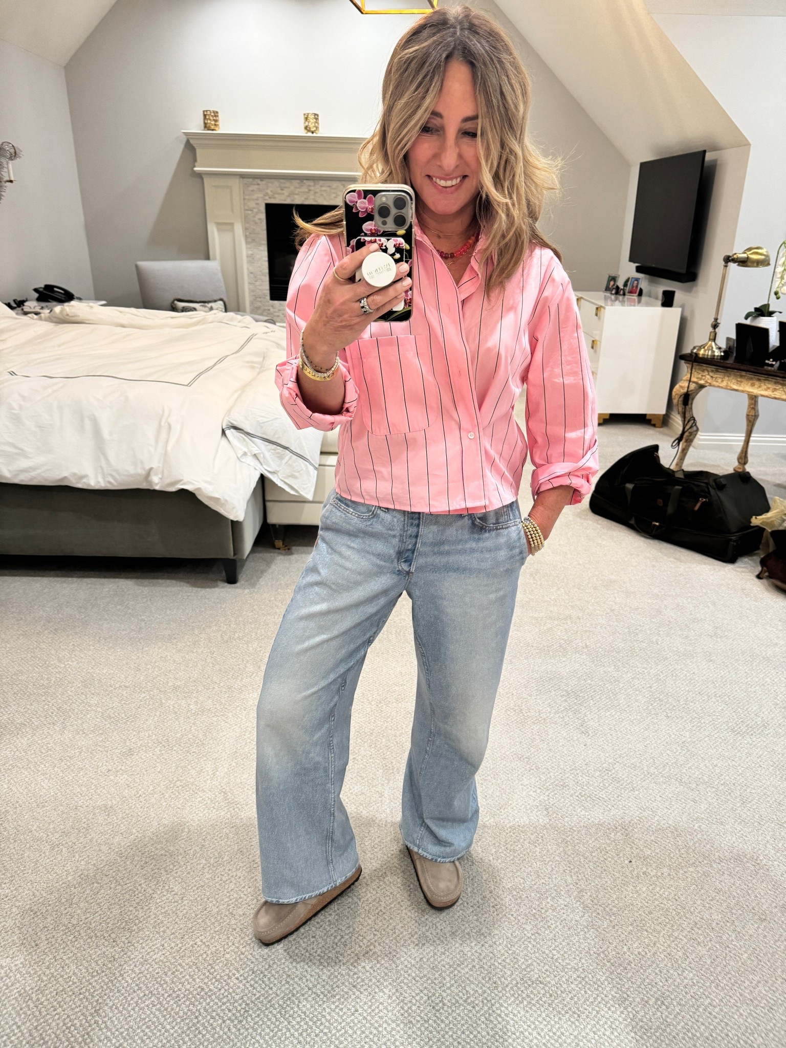 I’m really liking shorter button ups lately. They seem to pair so nicely with lighter leg jeans and then you don’t have to tuck them in. This one’s extra special because it hasn’t added button on the side to give it a little cinch at the waist. You also may notice that I’ve been wearing these Birkenstock Buckley’s in so many of my pictures lately. I’ve been wearing them All. The. Time.

#LTKOver40 #LTKSeasonal #LTKHoliday