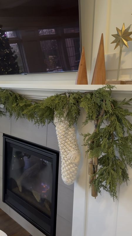 I LOVE this artificial garland! It drapes beautifully. I have two six foot pieces tied together to make one long piece of garland on my mantle. 

#LTKhome #LTKSeasonal #LTKHoliday