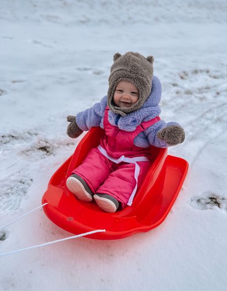 Toddler sled with a back and buckle for extra support our baby girl loves this!! These are her exact hat bd mittens too, the under chin velcro is clutch for winter weather play. 

Baby sled
Baby winter snowsuit
Winter overalls
Snoveralls
Baby winter coat
Baby winter hat
Baby winter mittens
#competition

#LTKSeasonal #LTKFind #LTKbaby