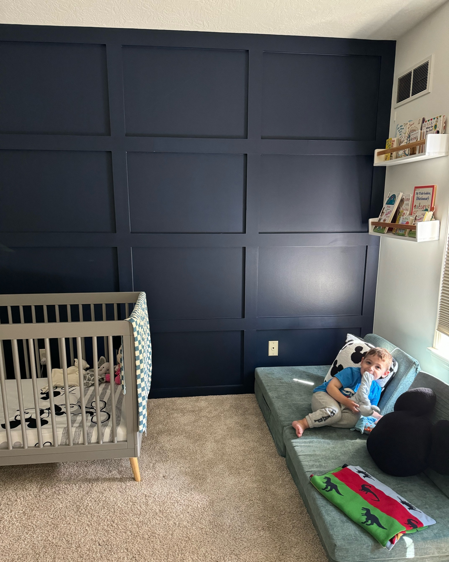 Toddler room decor. Accent wall. Toddler play couch. Baby boy room decor. Boys room design. Bookshelves. Toddler boy room ideas. Mickey Mouse home decor. 

#LTKHome #LTKFamily #LTKKids