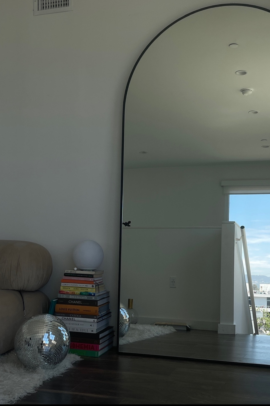 home isn’t complete without a giant arch wall mirror, thee billini sofa, a disco ball and changing color light #home #homedecor #amazonhome

#LTKhome #LTKSeasonal #LTKsalealert