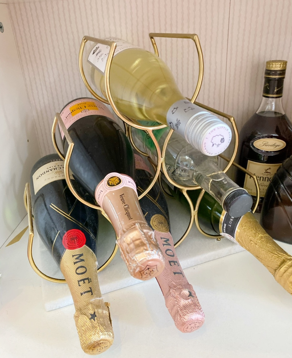 Make your bar cart pretty with this gold and marble wine rack! Saves space and so chic

#LTKhome #LTKunder100 #LTKSeasonal