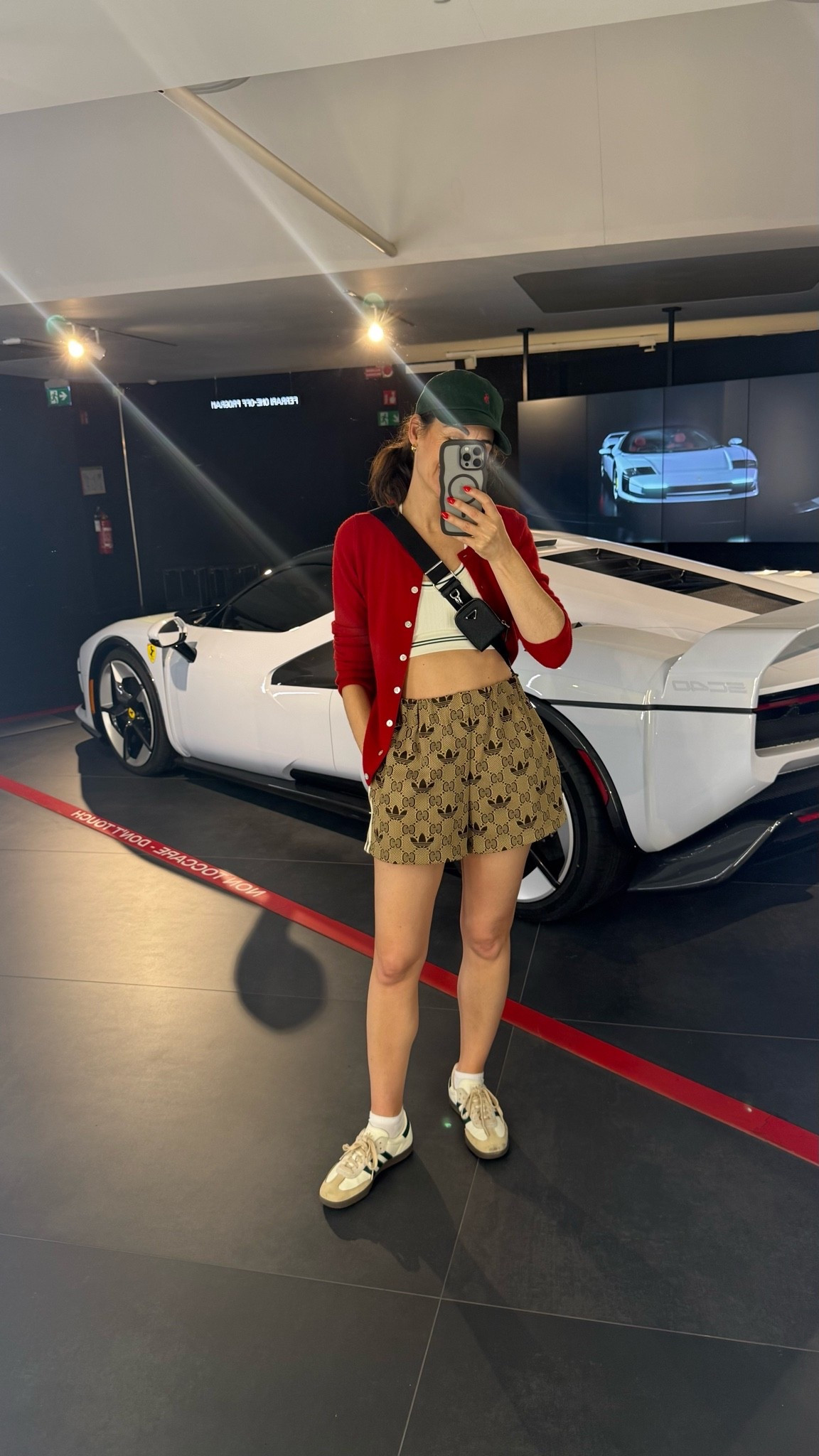 While everyone was taking pictures of cars I was busy taking selfies at the Ferrari museum. My high low haute mama OOTD includes Gucci shorts. These I borrowed from the boys. They were long and I had them hemmed. Men’s shorts are less expensive and a more forgiving fit than women’s
