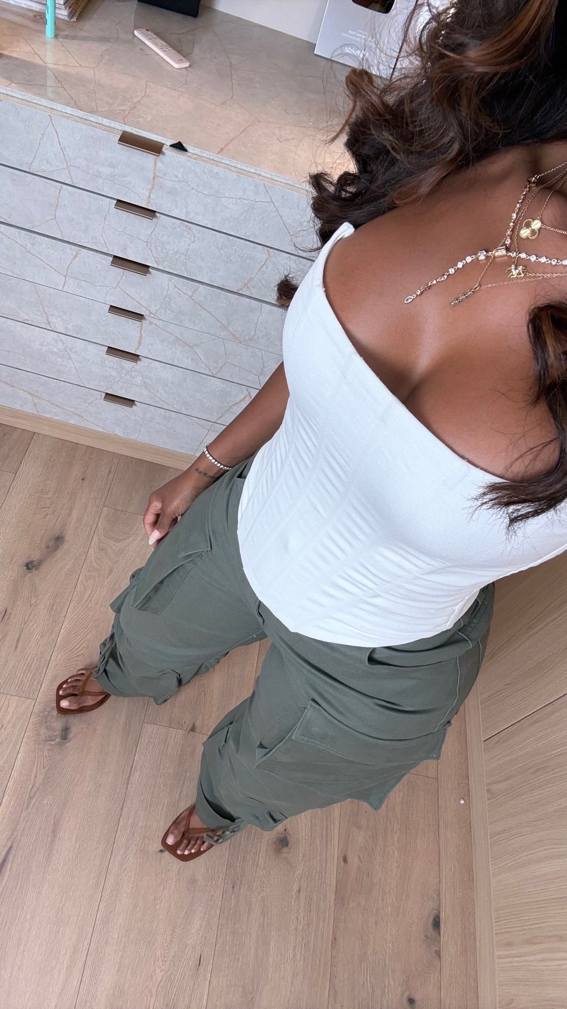 Hi Babes! 🤍🌿

This is one of those effortless outfits you'll keep reaching for! The structured white corset top paired with these relaxed cargo pants gives the perfect balance of feminine and casual.

✨ Fit Details:
• White corset-style top
• High-waisted olive cargo pants
• Neutral slide sandals
• Layered gold jewelry
• True-to-size fit

☀️ Where to Wear:
• Weekend errands
• Lunch with friends
• Casual date night
• Travel days
• Everyday summer wear

🤍 Style Tip:
Throw on a denim jacket and sneakers for a more casual vibe, or keep it elevated with gold jewelry and neutral sandals.

Everything is linked below!

xx Kira | IG: KirasFashionFinds

Measurements: 5'4" | 140 lbs | Size Small
