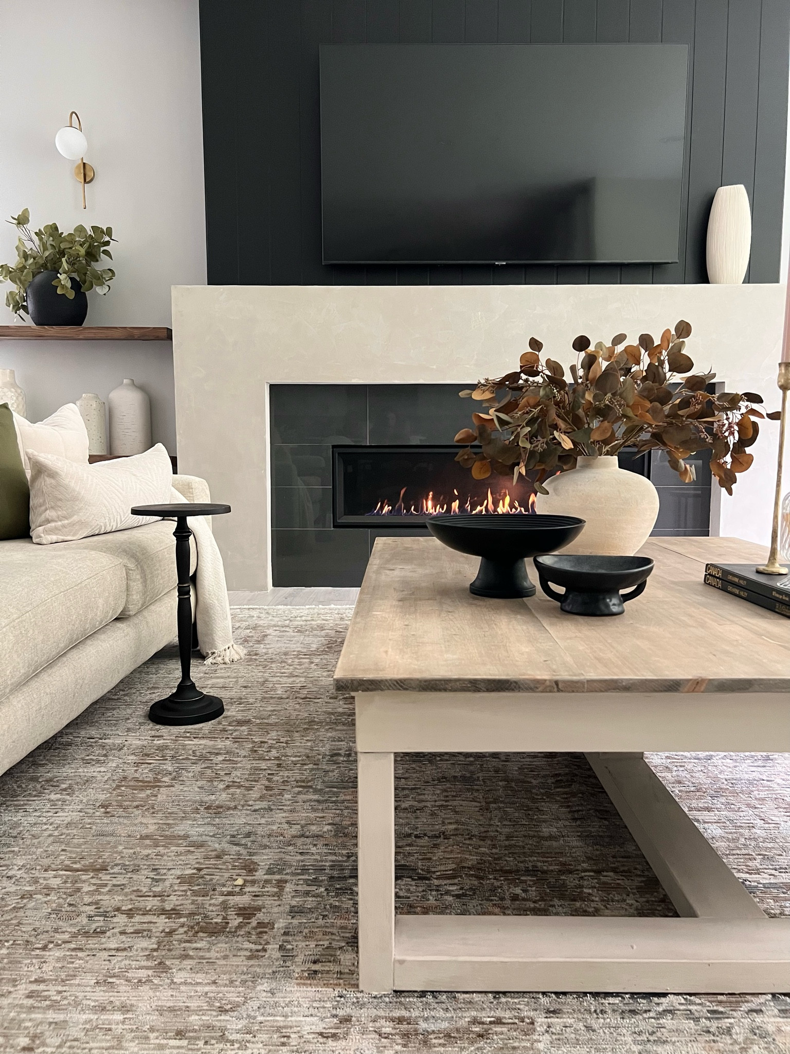 My coffee table : I get asked a lot about it! 
It’s the Cariton table from Ashley furniture that’s linked here. However, I replaced the top on it. We glued down 1” spruce over the existing top..stained it in a 50/50 Minwax ‘provincial’ and ‘grey’
The base is painted in Fusion mineral paint ‘cashmere’ 
