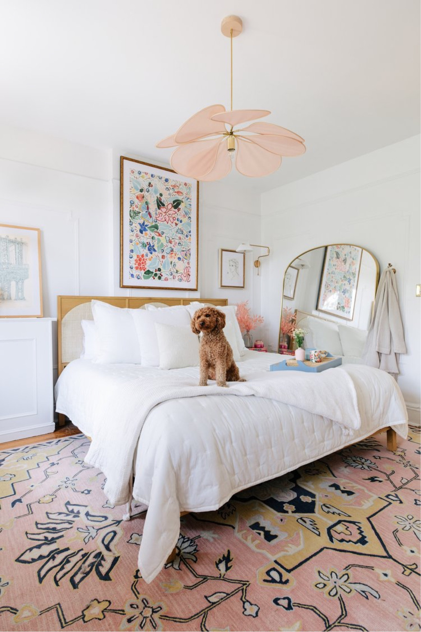 Colorful art in a neutral, master bedroom, small master bedroom styling pink chandelier 

#LTKhome
