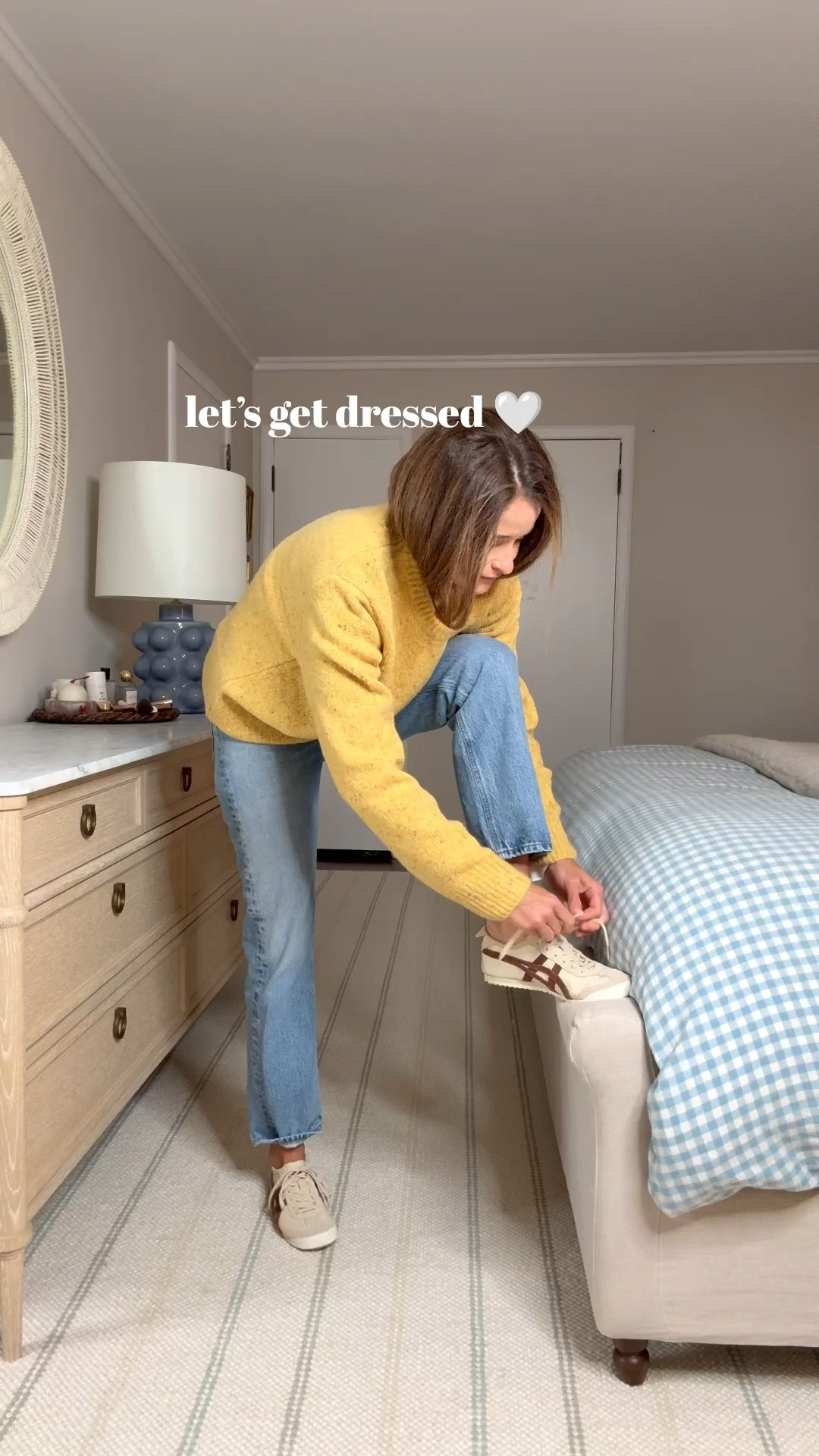 Happy Friday all! Fall is officially here and I have the perfect weekend outfit for you that will keep you warm, bright, and still pulled together. Alex Mill Donegal Crewneck is next level! I honestly can’t believe I never bought this sweater in the past but this year I truly could say no to this beautiful golden color. The Donegal was named after Donegal in Northern Ireland where it can get pretty blustery. This sweater is made with a Merino blend and is so soft, cozy and flattering. I’m buying this in so many colors and will be fighting off my husband for them all 😇 • AYR half day long sleeve is my go to long sleeve t-shirt for layering under sweaters this year. 4.8 stars from purchasers for good reason! It’s cute, comfy and can be worn all on its own too. • AGOLDE 90’s all day. You know this by now but these are the best straight leg jeans out there hands down. • Onitsuka Tiger sneaks. Love these trainers when dressing my outfit down especially in the colder weather with this beautiful brown color combo that goes with so many of my Fall outfits • Liffner tote is definitely an investment but she’s worth it. Such a gorgeous piece to compliment the outfit and super practical. • Amazon stud earrings and Ray-Ban sunnies to on repeat to tie it all together. Ok that’s all she wrote for today. Have a wonderful weekend!

Sizing notes: 

Sweater: sized up 1 to a medium. White long sleeve: wearing my true size, a small. My favorite layering shirt. Also looks great on it’s own. Jeans: run tts, in a 25. Size up if you are between. Sneakers are old but linking a few places to grab 💛