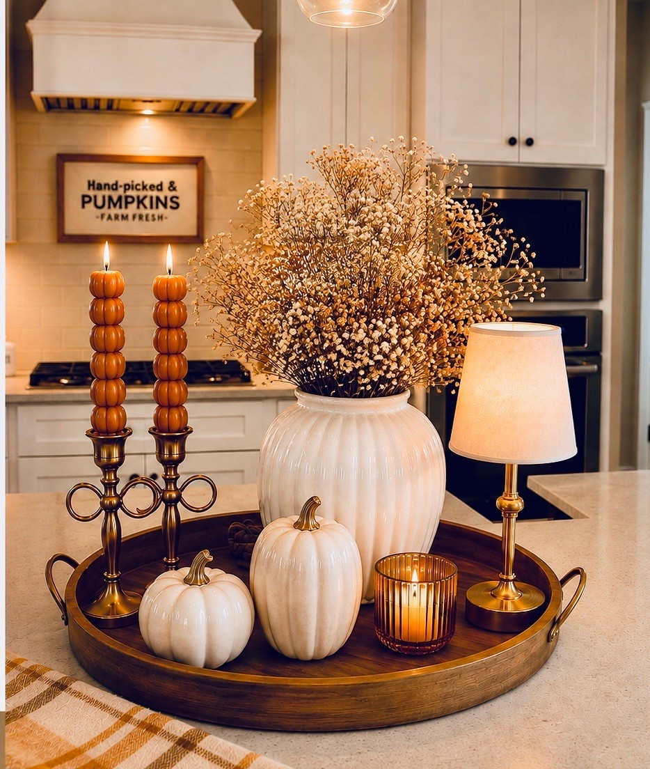 POV: You’re officially ready for cozy fall 🤎🍂
 You want to decorate for fall in your kitchen…but make it cozy, neutral + a little elevated ✨

A few pumpkins, a vase of faux fall branches, warm brass, candlelight and a wood tray = the easiest fall centerpiece. 🎃

Everything is linked so you can recreate the look! 🛍️

#falldecor #fallcenterpiece #fall #cozyfall #falldecorating

#LTKHome
