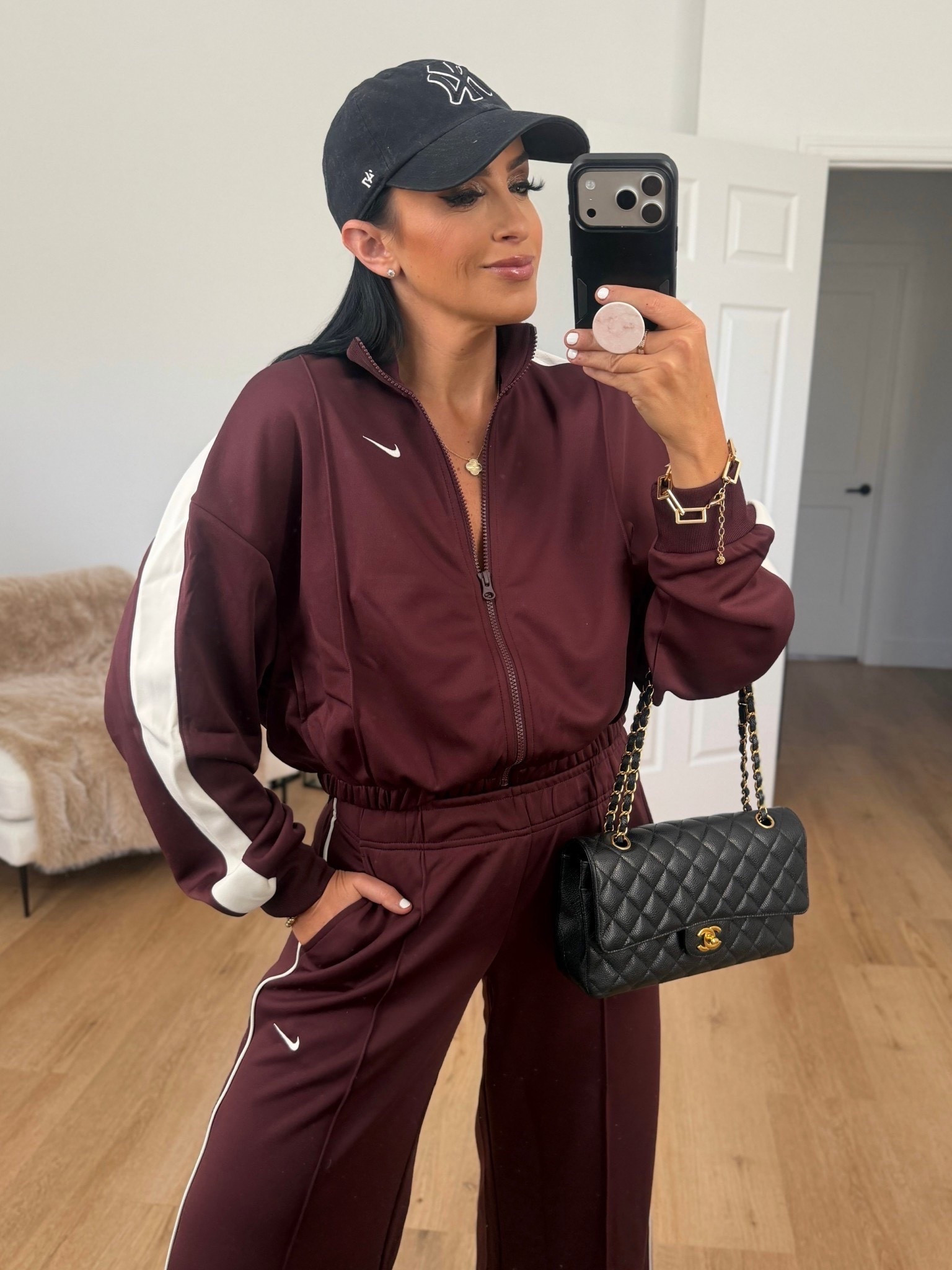 Nike Sportswear Women's Track Jacket wearing size small. Nike Sportswear Women's Mid-Rise Wide-Leg Track Pants wearing size small. 

Nike 25% off 