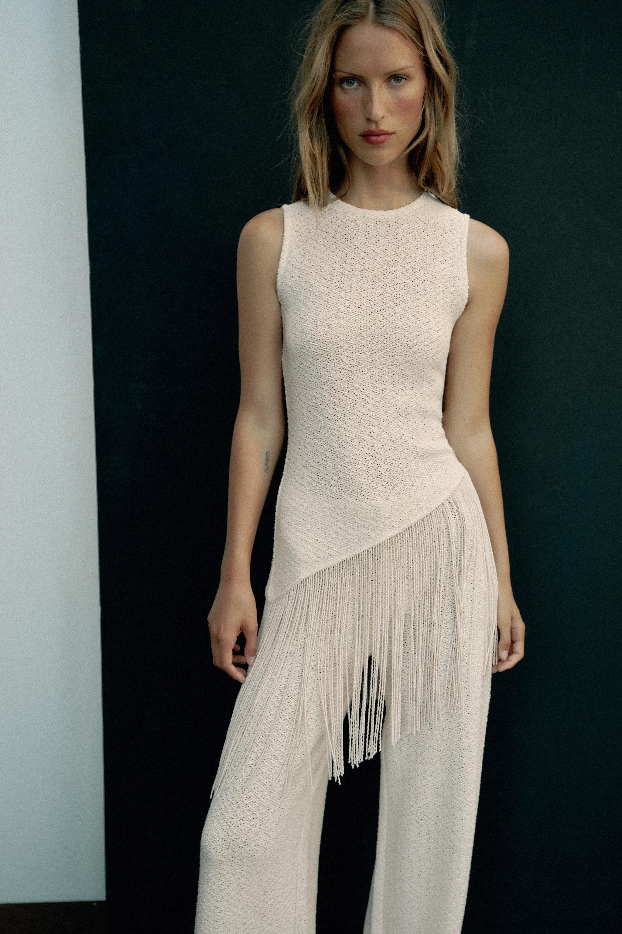 Top made of cotton blend yarn. Round neckline and sleeveless. Featuring tonal fringe appliqu\u00e... | Zara US