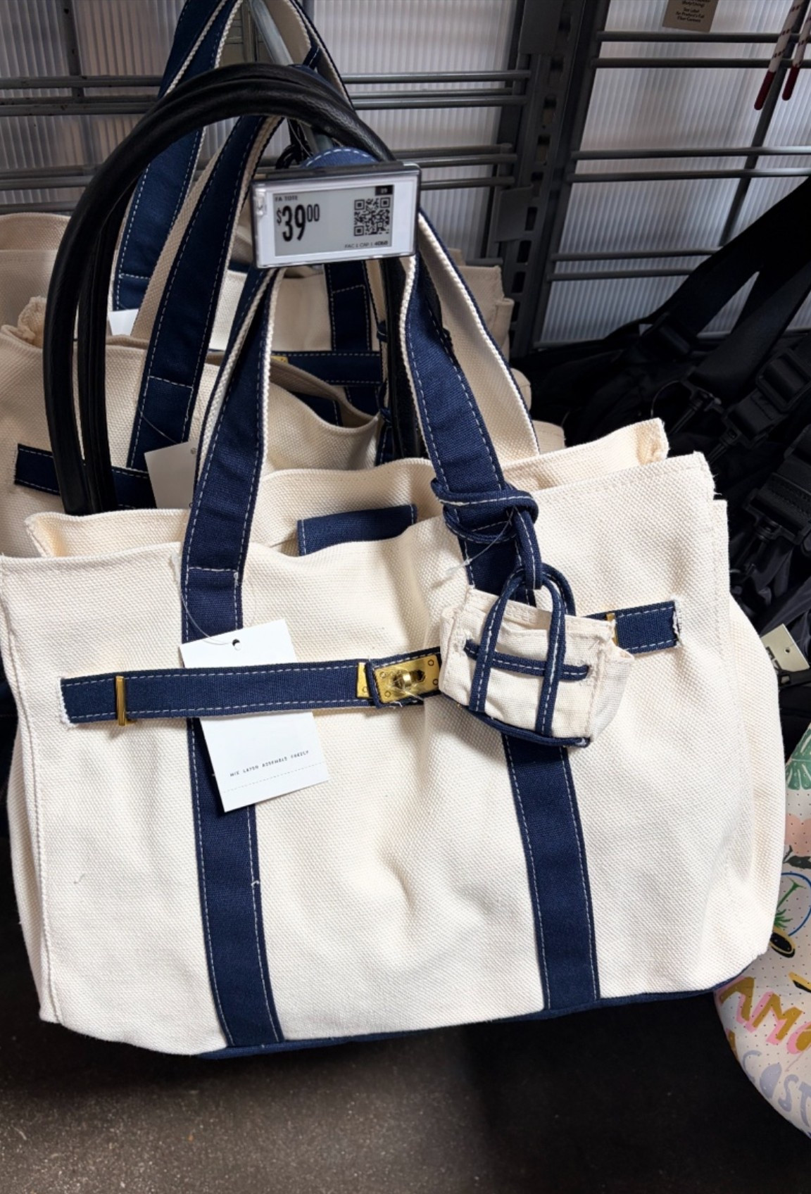 Meet your new everyday statement piece: Free Assembly's Canvas Tote Bag. Crafted from 100% cotton canvas, this tote stands out with colorful, contrast trim that adds a playful vibe and a structured silhouette with a front buckle lock, giving it a polished, designer-inspired feel. A charming mini tote bag dangle brings a fun, unexpected twist—perfect for holding small essentials or simply enhancing the bag’s personality. Only at Walmart

#LTKSwim #LTKSaleAlert #LTKTravel