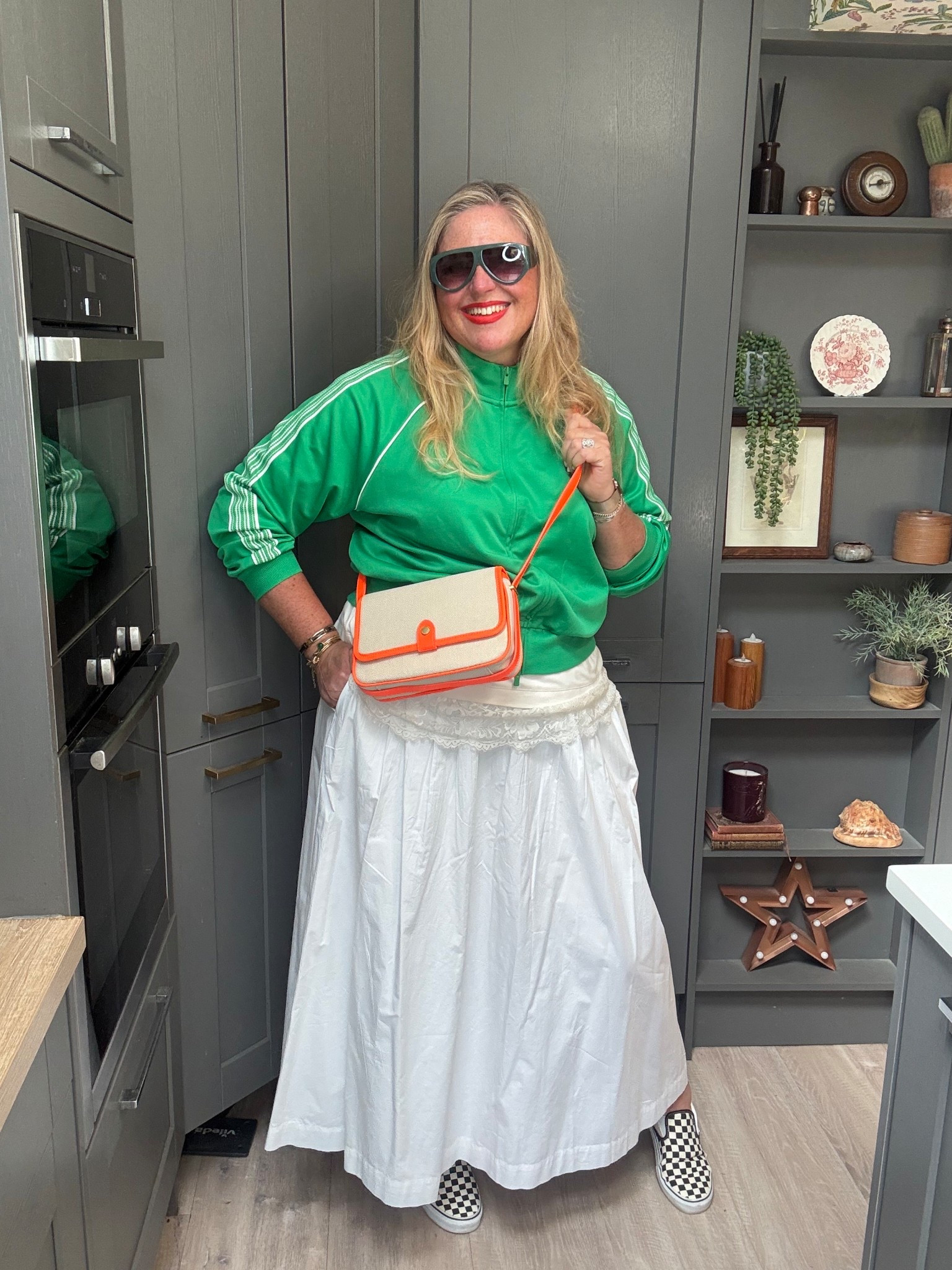 White midaxi skirt, checkerboard vans, green sunglasses, green zip top, white lace tshirt, orange bag 

#LTKplussize #LTKstyletip #LTKspring