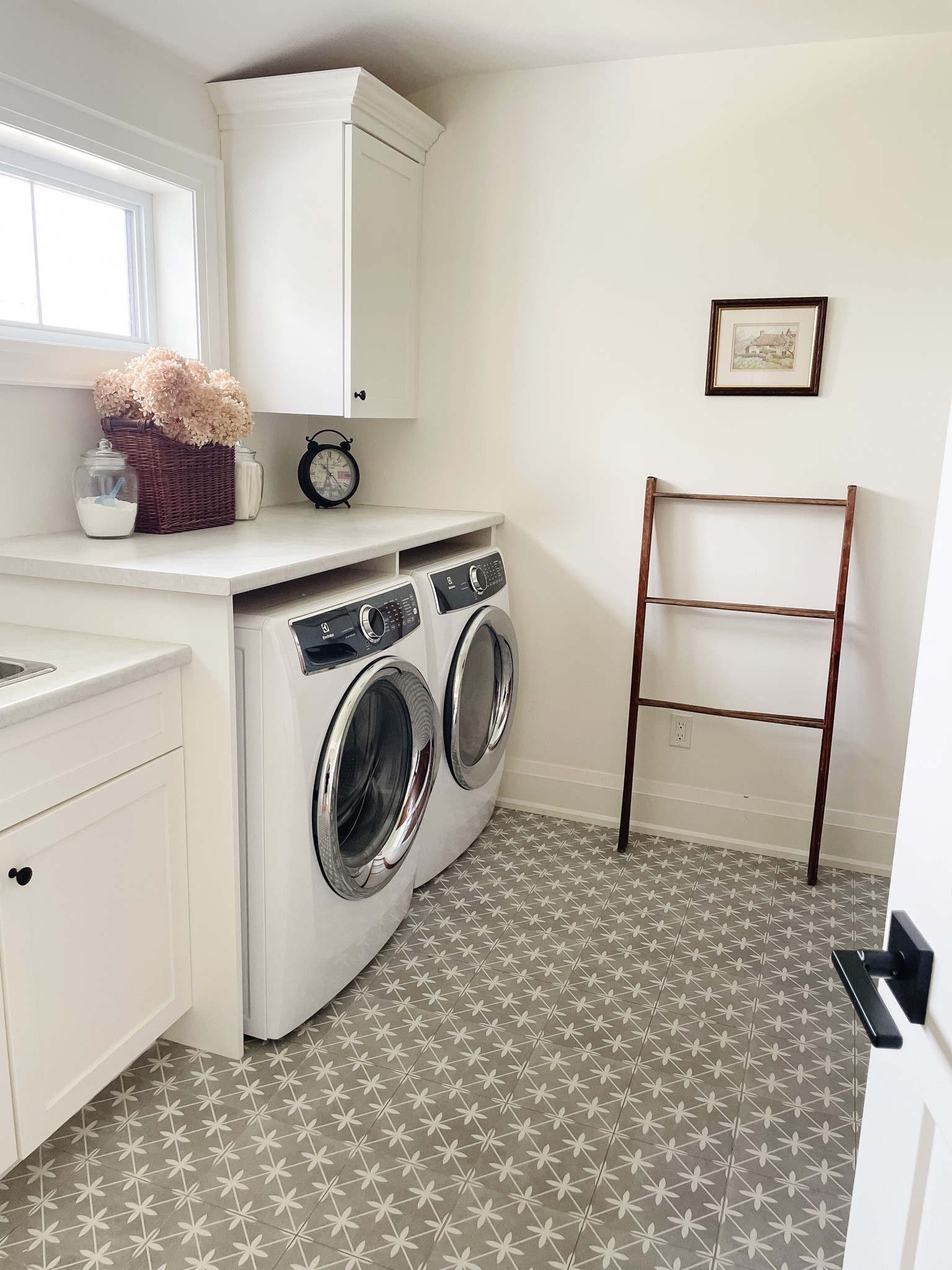 FARMHOUSE LAUNDRY ROOM DETAILS
.
Here’s some thoughts: 
- Adding glass containers for laundry supplies
- Add a clock so you’ll get laundry done as quickly as possible :) 
- Add baskets and flowers to make it happy 
- Add vintage touches to add character and functional uses (drying rack)   

#LTKhome #LTKstyletip #LTKFind