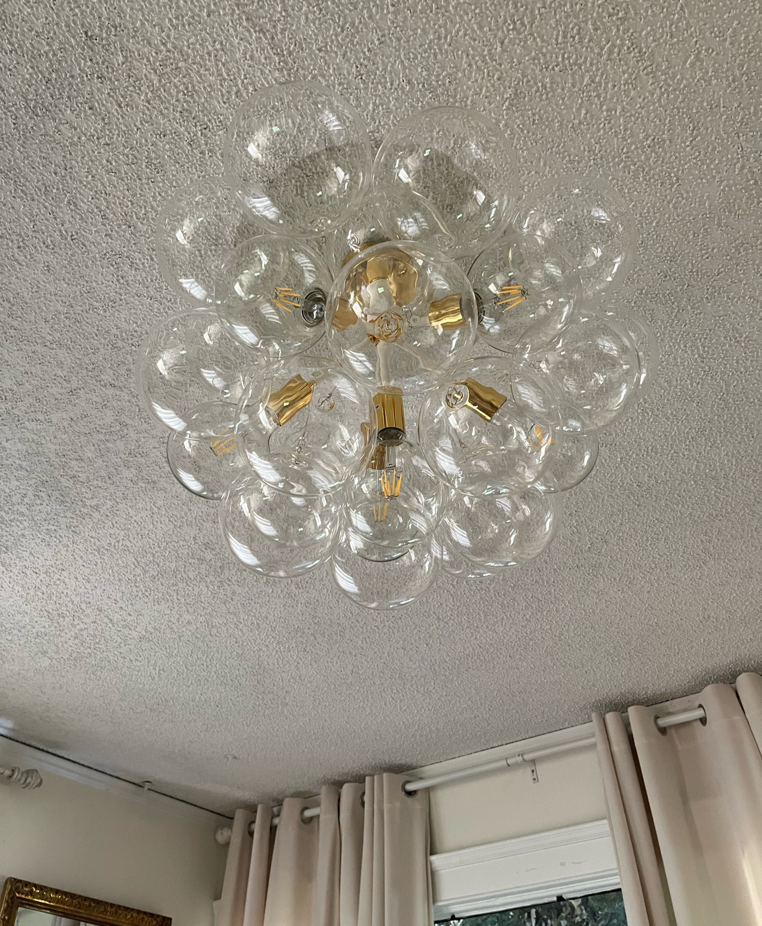 This Bubble glass chandelier complements my living room! Definitely eye catching and center of attention

#LTKhome #LTKfamily