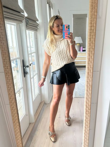The cutest faux leather skort. Runs small. Size up. I’m wearing a medium.  Code FANCY15 for 15% off this and sweater (size small) 

#LTKunder100 #LTKFind #LTKstyletip