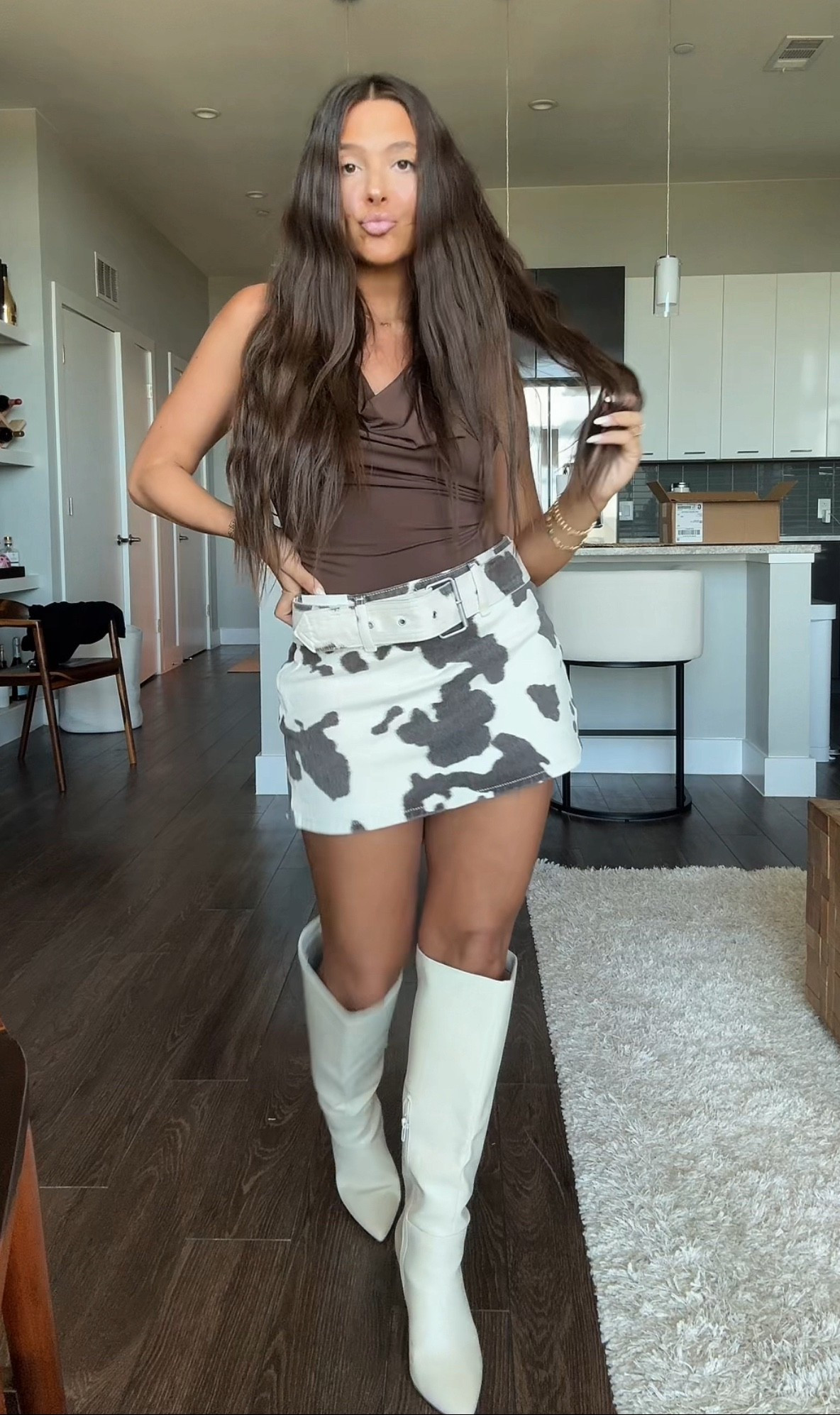 SUCH an Ashley outfit! I can’t get over how cute this buckle cow print mini micro skirt / skirt is!! 🐄 it also comes in denim! The top has an adorable tie in the back or can be worn to the side as a scarf of a kind. Such a good western outfit!! 

#LTKFindsUnder50 #LTKSeasonal #LTKFindsUnder100