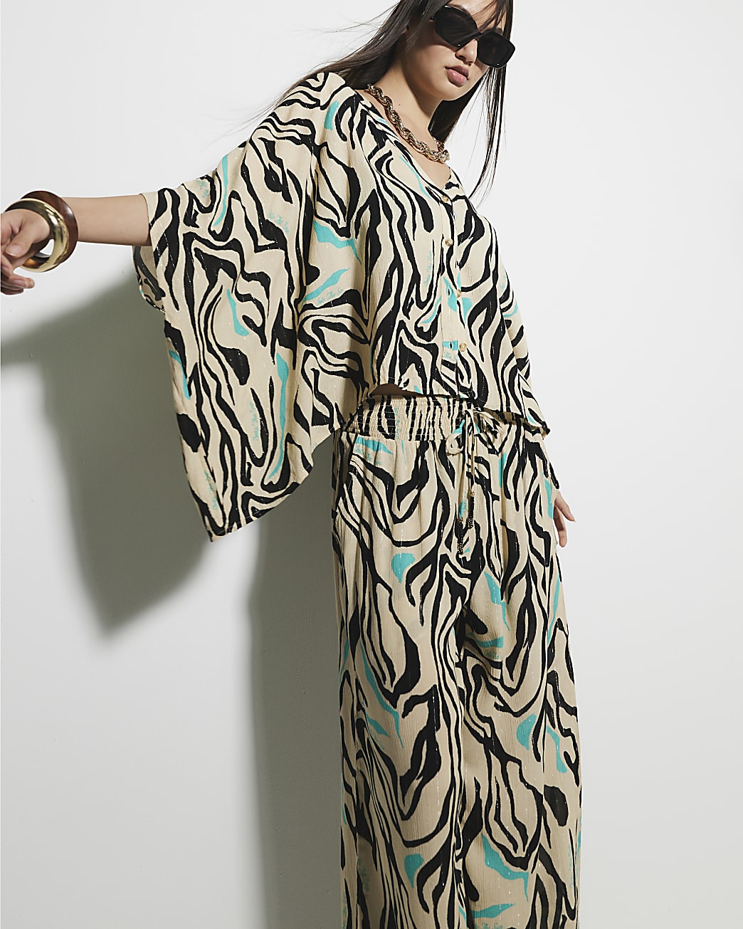 Cream Zebra Print Wide Leg Trousers | River Island UK & IE