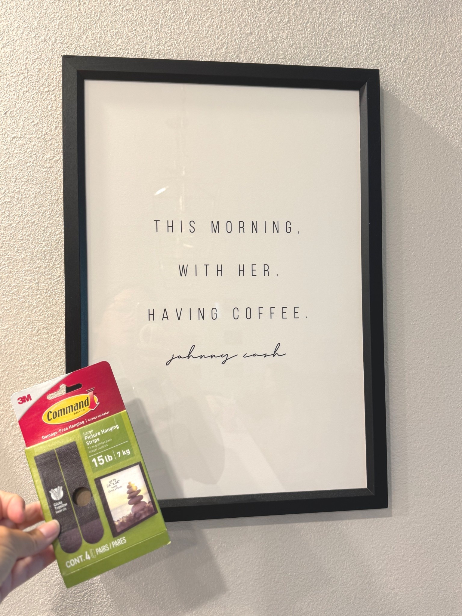 My husband is so good about reminding me we can hang art without making holes in the walls 🙌🏻🙌🏻🙌🏻 If you like to change decor or rent this is even a bigger game changer for you!
They now make these command strips in black for photos so they aren’t visible!
I put 2 strips on this frame. One at the top and one on the bottom and it’s a little over 14x20”. 
#walldecor #homehack 

#LTKHome