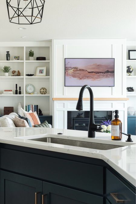 Open concept kitchen inspo. 🤍

Samsung frame TV, loloi area rug, bench sofa, accent table, matte black faucet, slate blue chairs, wood oval coffee table  

#LTKStyleTip #LTKHome #LTKFindsUnder50