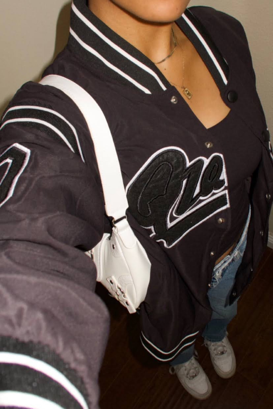 white shoulder bag, white buckle bag, letterman jacket, oversized jacket, bomber jacket, zara jeans, straight leg denim jeans, streetwear fashion, fall fashion, white nike air force 1s

#LTKshoecrush #LTKstyletip