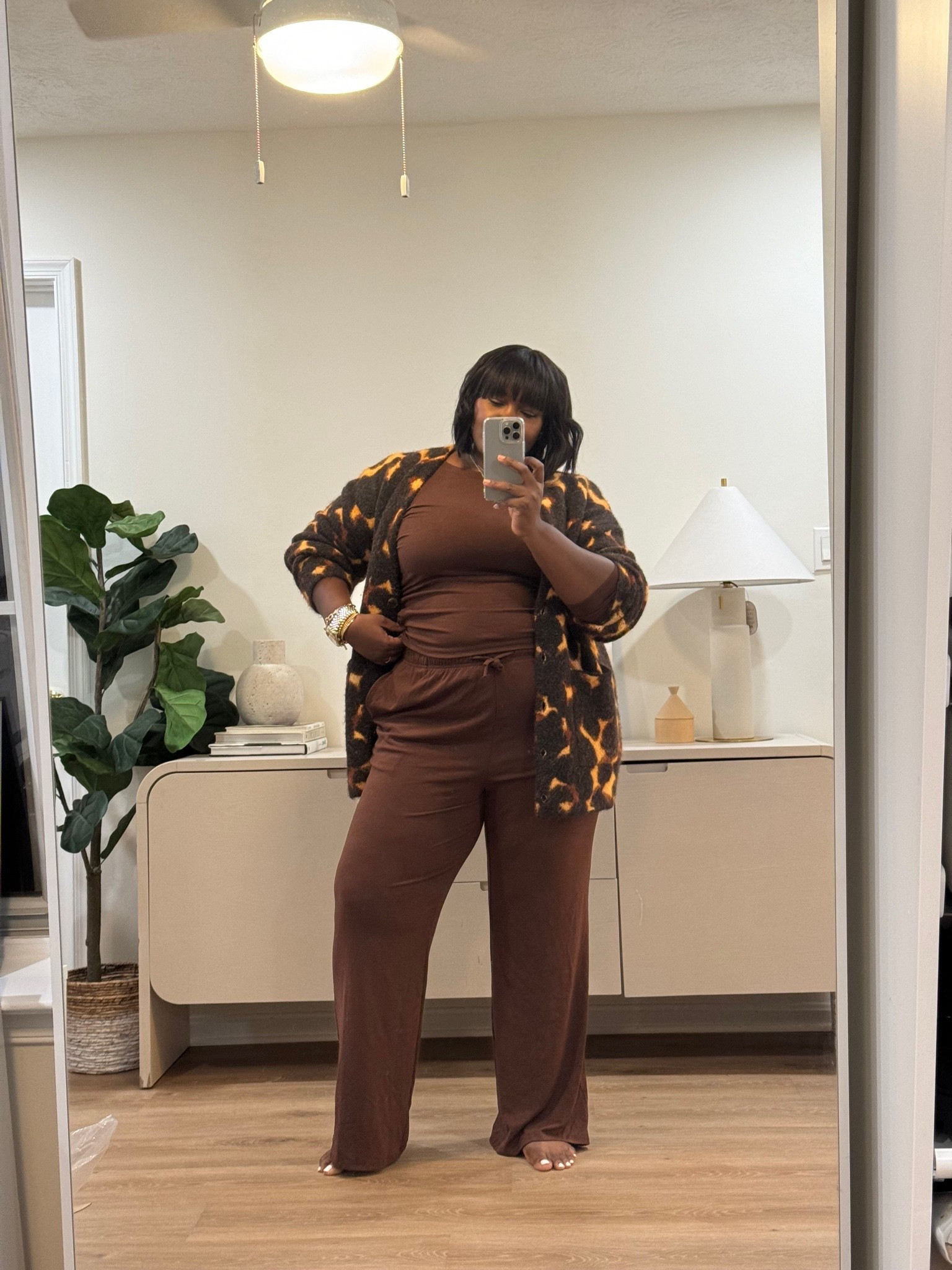 Getting dressed doesn't have to mean starting from scratch. A matching brown set handles the base, while a statement cardigan brings the personality. easy fall outfits, cardigan and pants outfit, brown matching set, casual chic outfit, curvy fall style

#LTKootd #LTKSeasonal #LTKMidsize