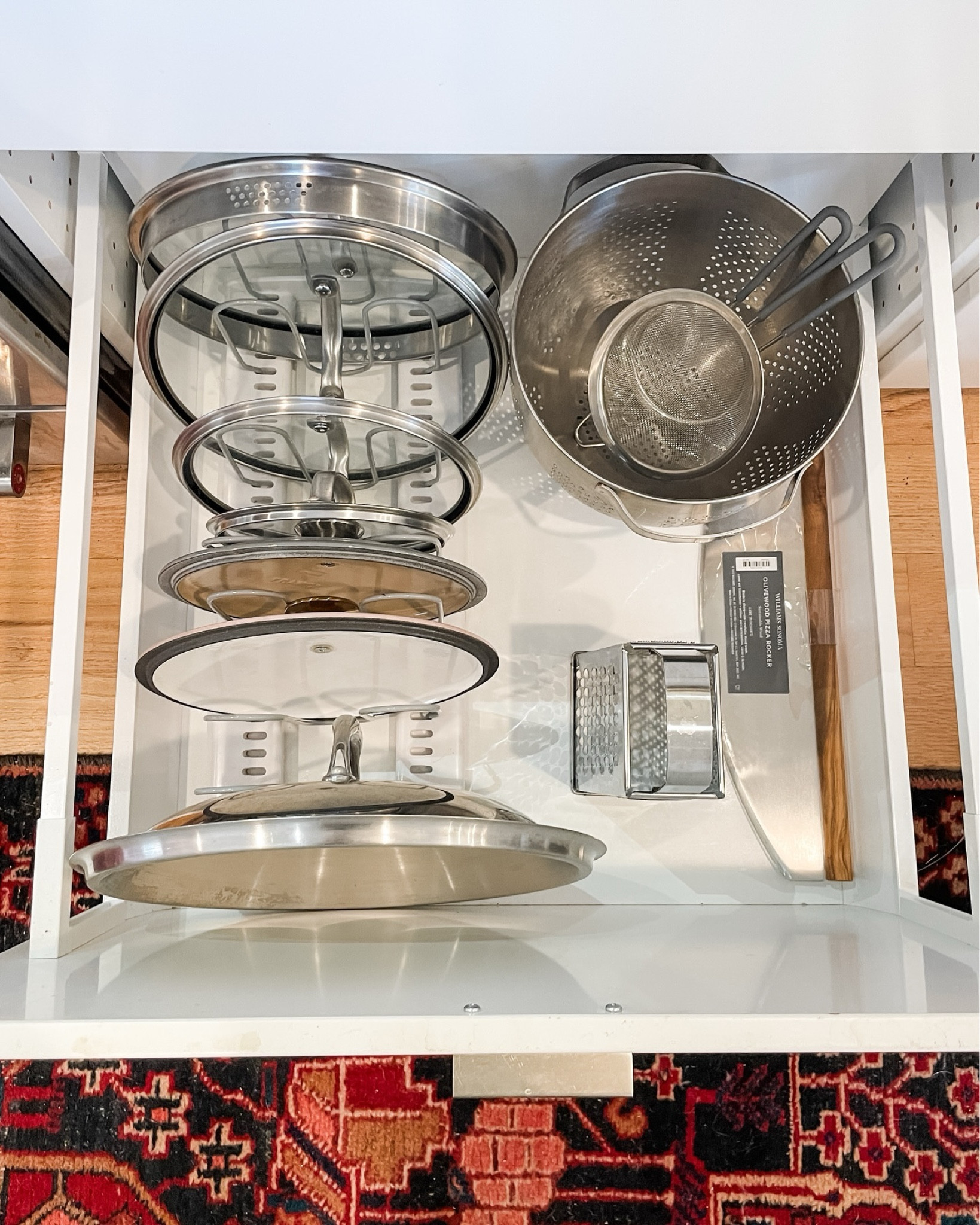 Can we just talk about this drawer for a second?! Vertical storage perfection. 
⠀⠀⠀⠀⠀⠀⠀⠀⠀
A product that we are getting a TON of mileage out of right now is this expandable kitchen organizer. We’ve used it for lids, pans, cookie sheets, and even Tupperware lids. 
⠀⠀⠀⠀⠀⠀⠀⠀⠀
What would you use it for in your home? *hint* It doesn’t have to stay in the kitchen!