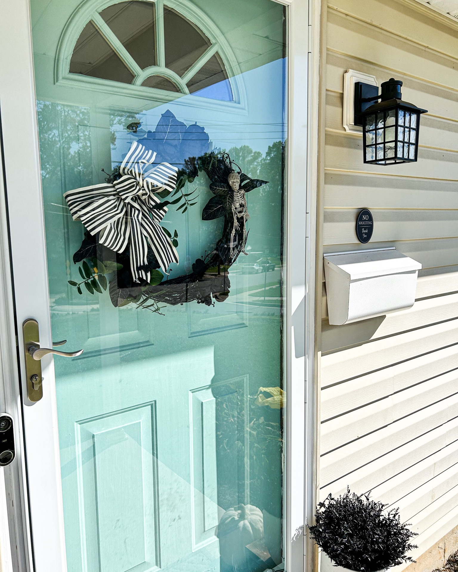 Loving the pops of black and the white mailbox against our aqua door.

Wreath is homemade. Light and sign are linked below.

#frontporchdecor #hintsofblackdecor

#LTKfindsunder50 #LTKHalloween #LTKhome