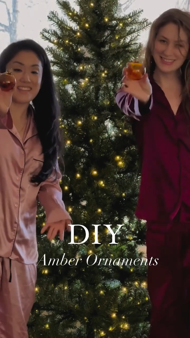 Tutorial Details 👇

1. Remove the top of the ornament so you can access the inside
2. Add a few drops of ink - the more you add, the richer the color will be. You can mix colors to make a pretty marble effect
3. Swirl the ink around the ornament. To get cohesive coverage you must keep swirling until completely dry
4. Dry the ink by blowing cool air into the ornament whilst swirling 
5. (Optional) paint the tops of the ornaments gold to compliment the amber tone

Enjoy your custom Amber ornaments! 🎄✨ 

🔗 If you want the link to all the DIY supplies needed for this project comment "ORNAMENT" 

-----------------------------------------------

 Hi! We are @kaneshiromade and @dawn.of.a.daydream - DIY besties with a passion for creating beautiful spaces in our fixer-upper homes. 

Although we live on opposite sides of America, we just had to meet up to create a little shared sparkle during our favorite season of the year!

Follow along to see all the magic we created together and maybe even gain some Christmas inspiration for your own home 🫶✨

#diydaydream #diyhome #diygirlies #easyhomeupdates #christmastreeinspo #diybesties #holidaymagic #seasonalhomestyling #diychristmasornaments #diyholidaydecor #christmasdiyideas 

DIY Christmas ornaments | DIY besties | Amber baubles dupe | Christmas tree inspiration | home for the holiday holidays | best friend’s best Christmas | Christmas sparkle | happy holiday | DIY home renovation | fixer-upper | viral Christmas tree hack | Christmas decor fun | creative souls | creative community | fyp | interior design | festive finds | Christmas collection | crystal ornaments | brown ornaments | chridtmas decor hack | easy festive DIY | holiday magic | holiday activities | girls night | diy fun | weekend diy | diy dupe | boujie on a budget
