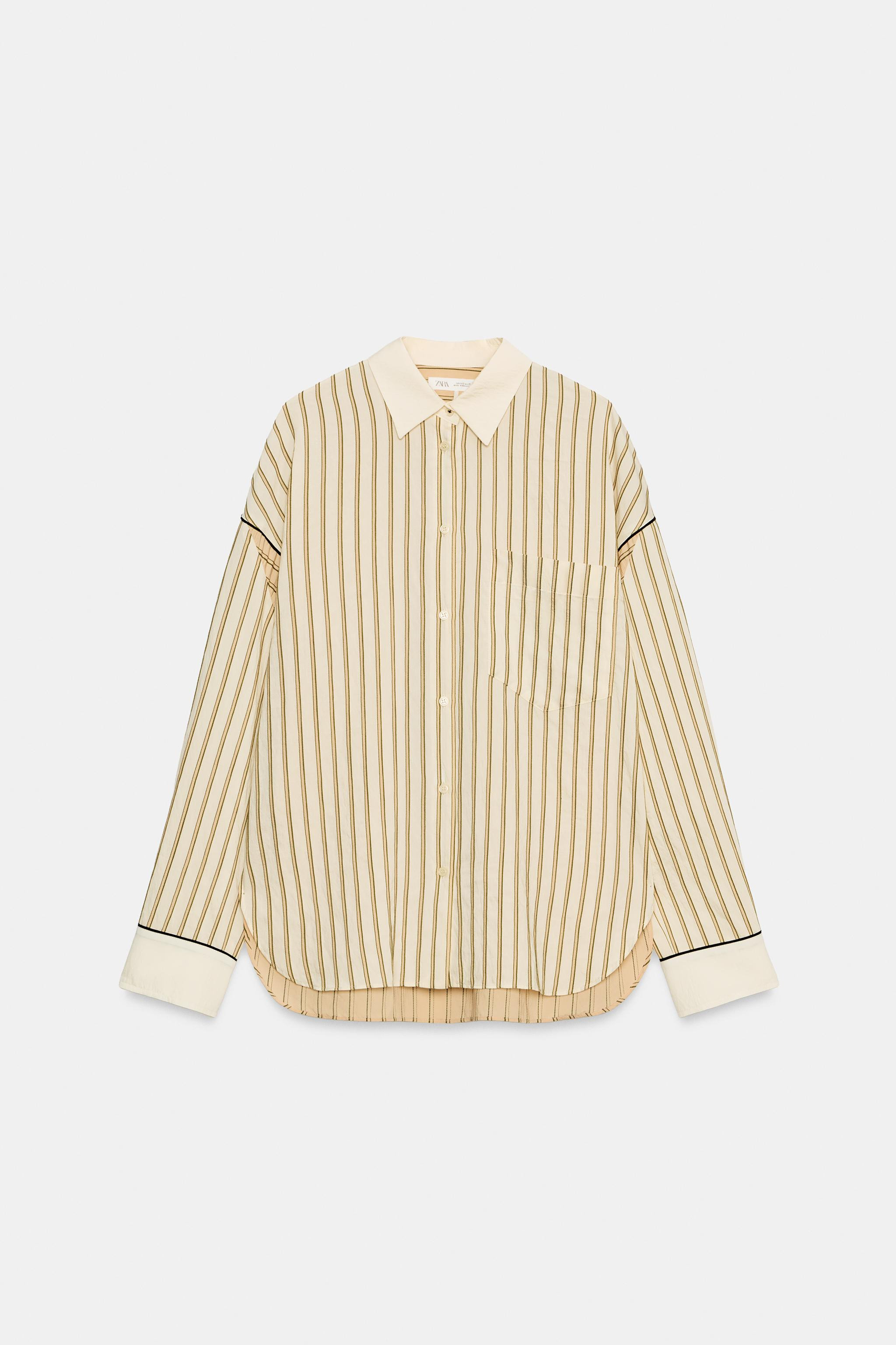 ZARA WOMAN COLLECTION. Shirt made of a viscose blend fabric. Lapel collar and long sleeves with c... | Zara US