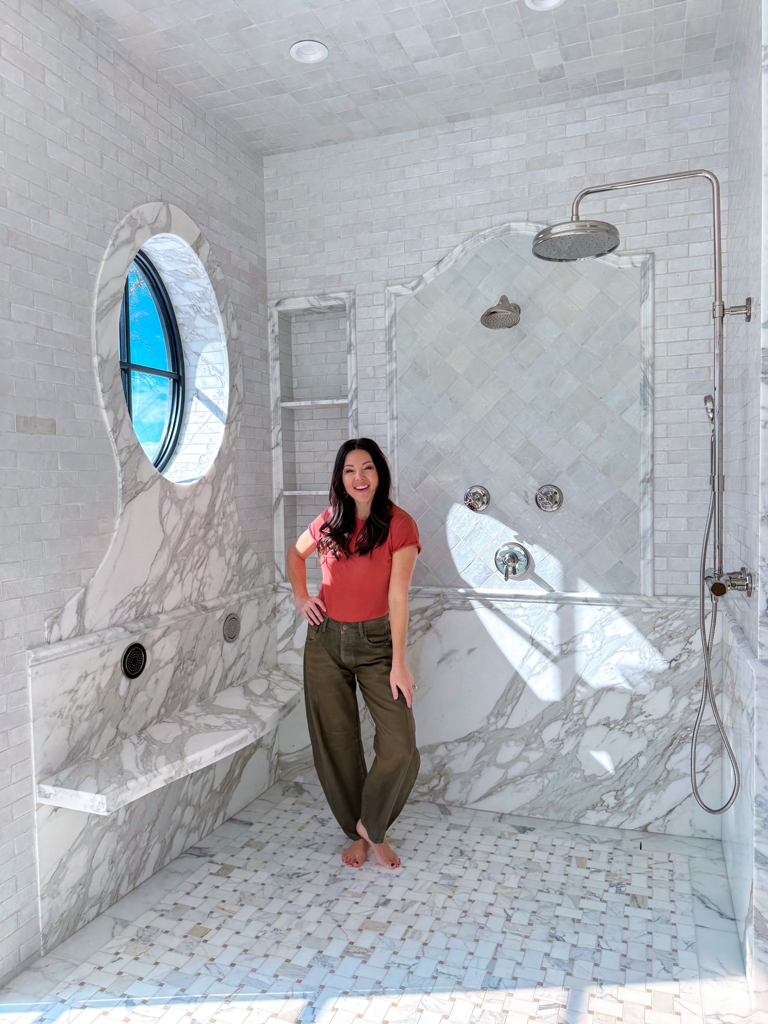 My dream shower is done! 
Marble slab creating lower walls, curved bench, and oval window casing. 
Marble chair rail creates a diamond inlay for clay glazed tile and brick lay pattern on all the other walls. Basketweave floor is my favorite!
Polished nickel plumbing - rain shower, body jets, and 2 shower heads.  


Primary bathroom remodel
Master bathroom 
Shower ideas 

#LTKHome