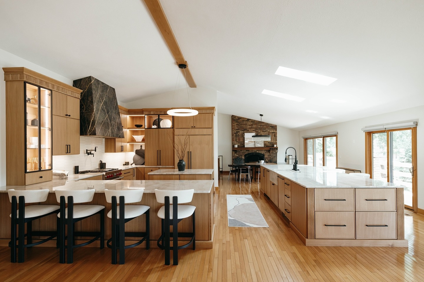 ✨ SHOP THIS Before & After Reveal! ✨

We just wrapped up a beautiful renovation that brought new life to a dated space — without replacing or refinishing the floors! That meant working within the existing footprint and being extra thoughtful about how everything came together.

In the kitchen, we removed a wall to open up the space to the living room and dining area, added two skylights above the island for extra natural light, and completely revamped the lighting throughout the open-concept layout.

Design highlights include:
• Custom cabinetry with black metal and glass doors
• A stunning marble hood in Black and Gold
• Taj Mahal quartzite countertops
• Hidden pocket doors for the microwave and coffee bar
• Cabinet-panel appliances for a seamless look
• A warm, creamy subway tile backsplash to tie it all together
• Kohler plumbing fixtures
• Alabaster light fixtures
• Reeded trim in white oak

And yes — we did all the decor in the living, dining, and kitchen spaces as well!

In the primary bathroom, we kept the existing tile and refreshed the space with a new vanity, updated countertops, and modern lighting for a simple but impactful transformation.

Swipe to see how far this home has come. We loved the challenge and the results speak for themselves!

Huge thanks to everyone we partnered with to bring this project to life

JM Electric
Thoele Plumbing
JCR Carpentry and Remodeling 
Probst Refrigeration & Heating Inc
@pyramidtops 
@subzeroandwolf 
@kohler 
@bedrosianstile 
@visualcomfort 
@topknobs 
@a_r_flooring_llc 
@arhaus 
@crateandbarrel 
@ruggable 
@wholefoods 
@astridjohanaphoto 

#BeforeAndAfter #InteriorDesign #KitchenRenovation #OpenConceptLiving #EffinghamDesign #ElizabethYagerDesigns #TajMahalQuartzite #BlackAndGoldMarble #hometransformation

#LTKFindsUnder100 #LTKHome #LTKOver40