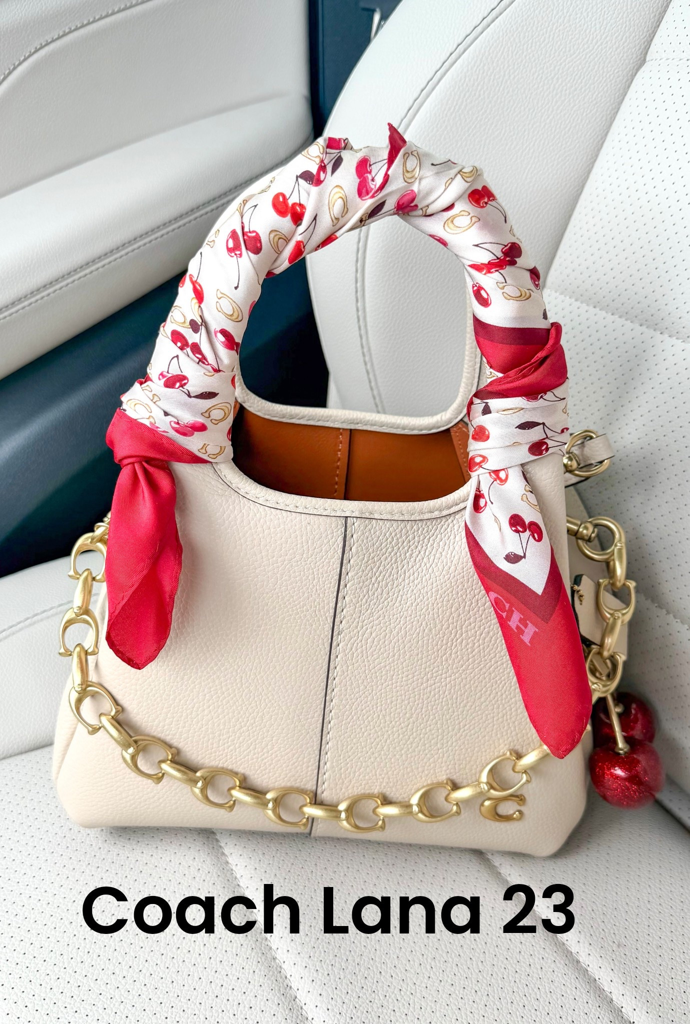 Coach Lana 23 …. How beautiful is she ?? I dressed her up with a beautiful scarf, bag chain and cherry charm 

How fun is this ? You can wear as a crossbody or take the crossbody strap off and carry as a hand bag 

Coach 
Coach bag 
Spring bag 
Summer bag 
Anytime bag 

Valentines gift 
Valentines gift idea 
Gifts for her 

#LTKValentine #LTKmomlife #LTKootd