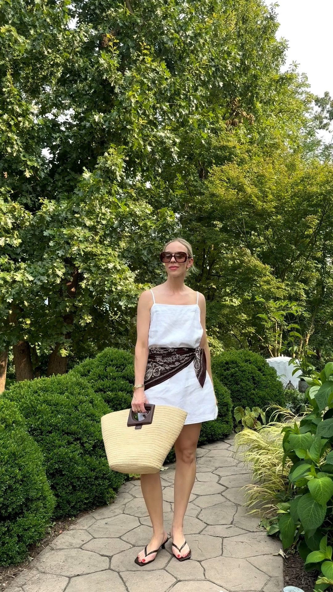 Summer outfit with white linen dress, brown bandana scarf tied at waist, Le Tanneur straw tote bag, kitten heel thong sandals, European vacation style

#LTKSaleAlert #LTKSeasonal #LTKTravel