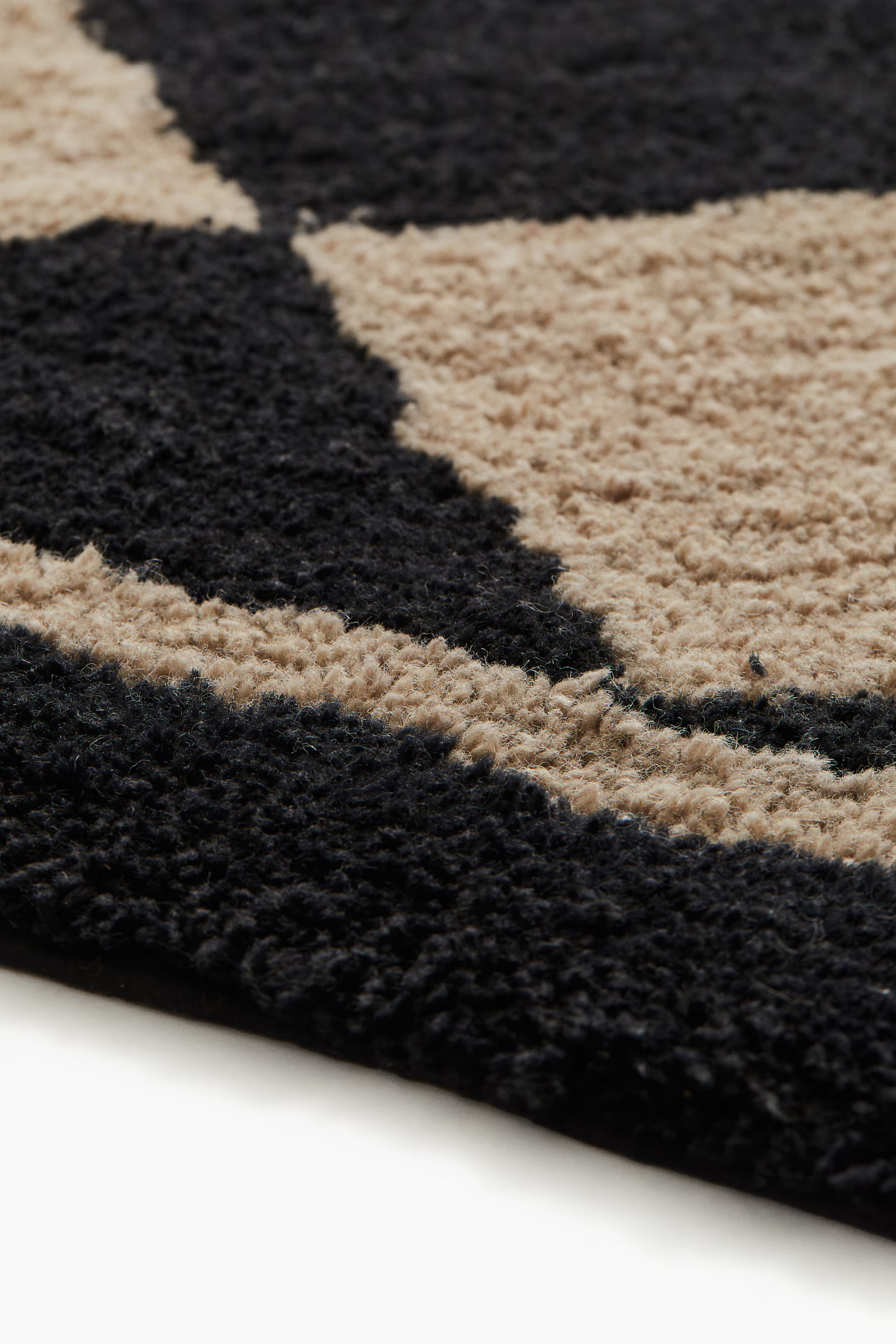 Tapis à motif arlequin en laine mélangée | H&M (FR, IT, ES, PT, BE)