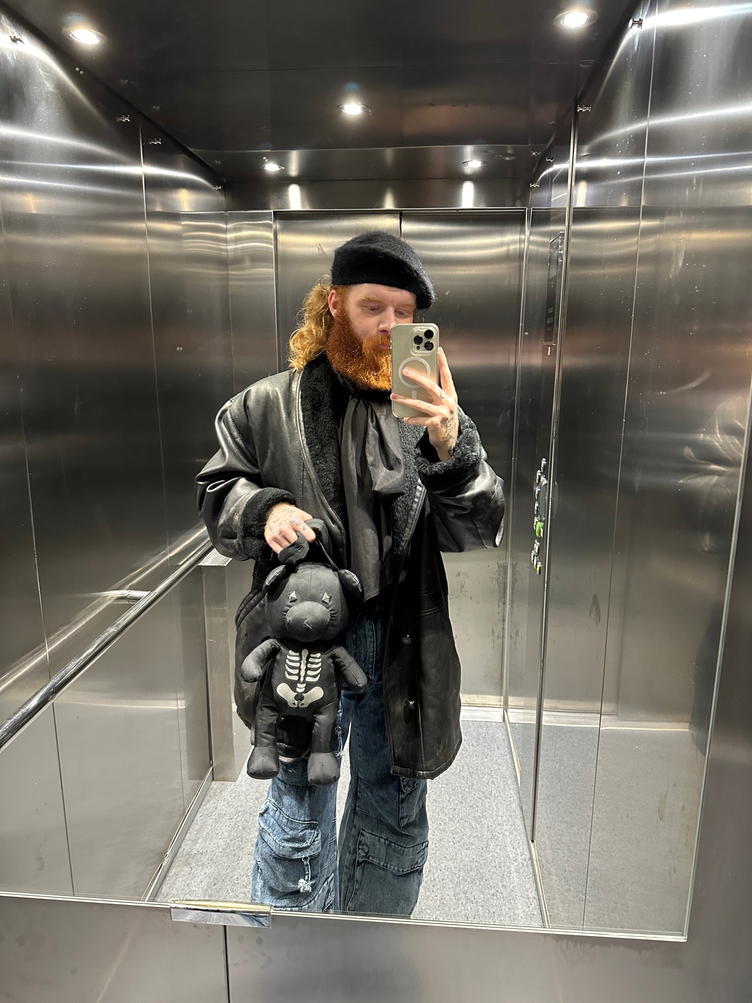 Fluffy knitted Beret, faux sterling jacket,  black distressed leather jacket, wide leg cargo jeans, vest backpack, black rucksack 

#LTKmens #LTKstyletip #LTKSeasonal