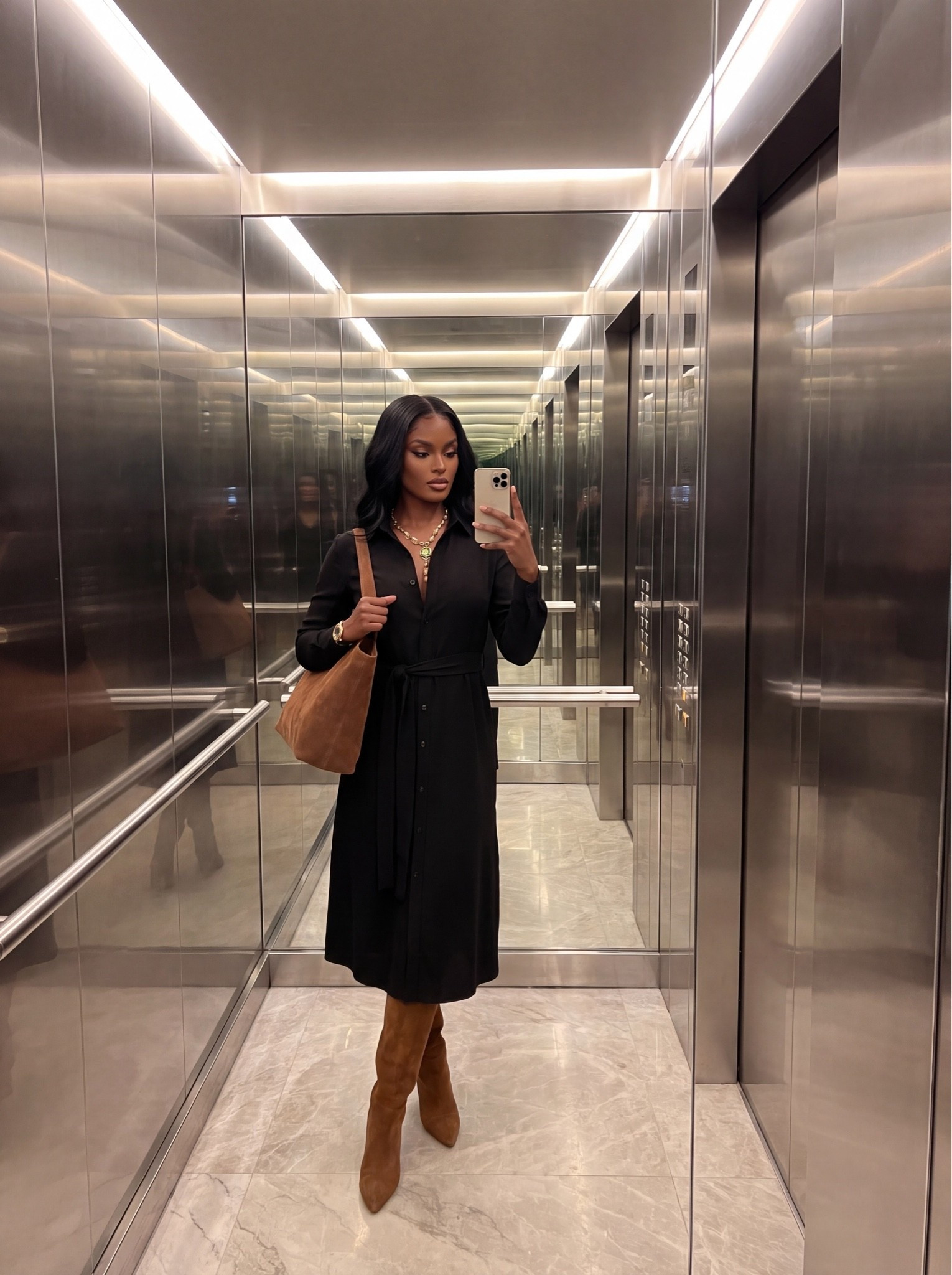 Elevator selfies before work? ✔️

Belted black shirt dress + suede knee-high boots + a slouchy suede tote for the perfect fall office-to-evening transition

Simple, polished, does the most with the least effort

#FallOutfitIdeas #SuedeBoots #ShirtDress  #FallFashion2026

#LTKWorkwear
