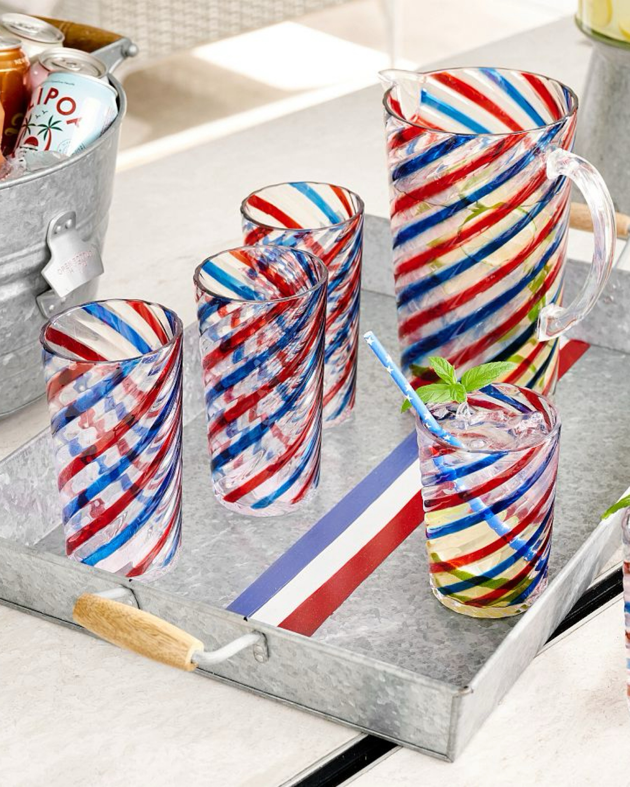 These Americana Striped Outdoor Tumblers feature swirled ribbons of red and blue on clear shatterproof material to create charming poolside and outdoor tumblers. Perfect for patriotic parties or outdoor fireworks gatherings!

#LTKParties #LTKHome #LTKSeasonal