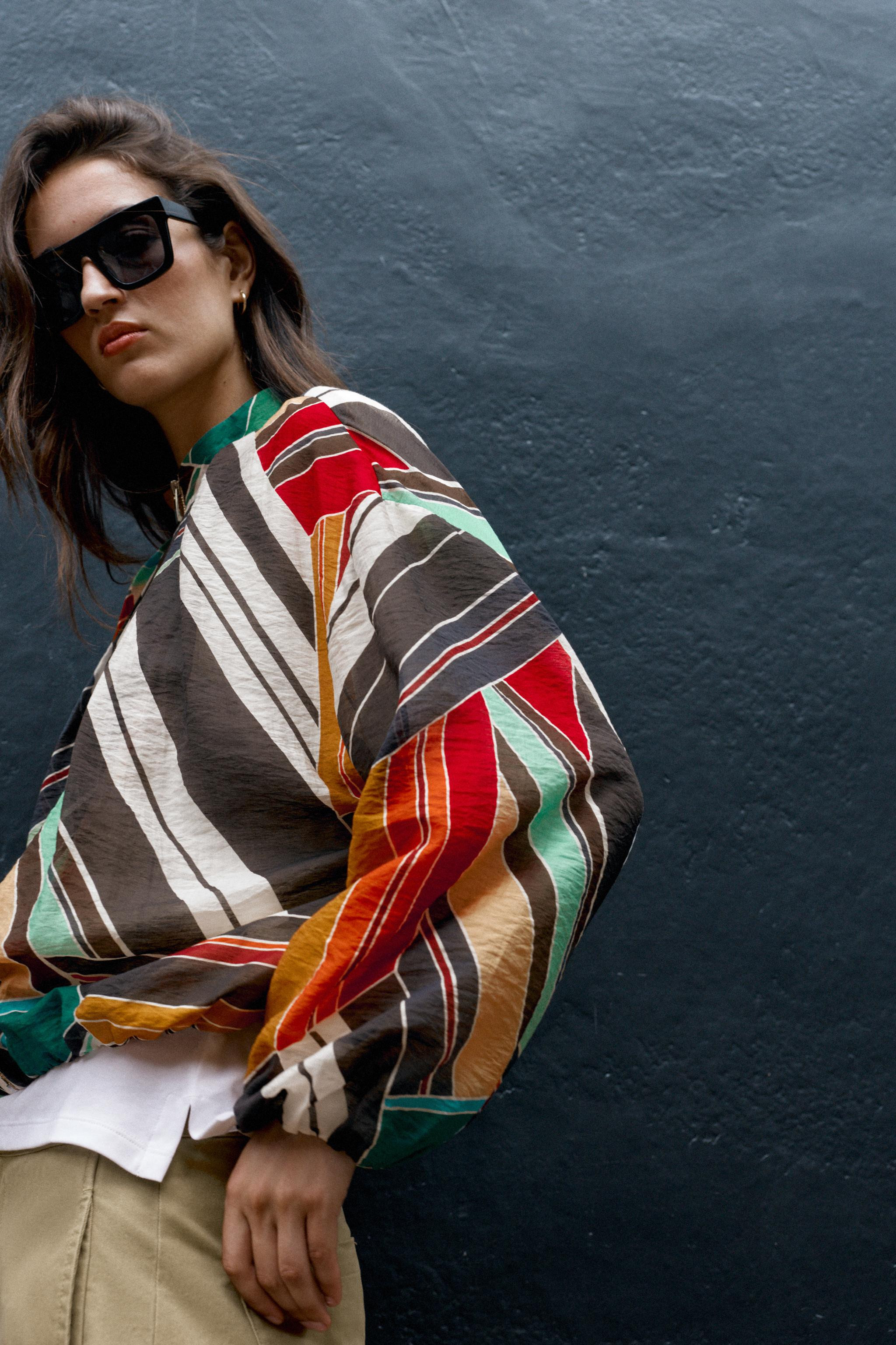 Model height: 183 cmBomber-style jacket with a high collar and long puff sleeves. Featuring side ... | Zara IT