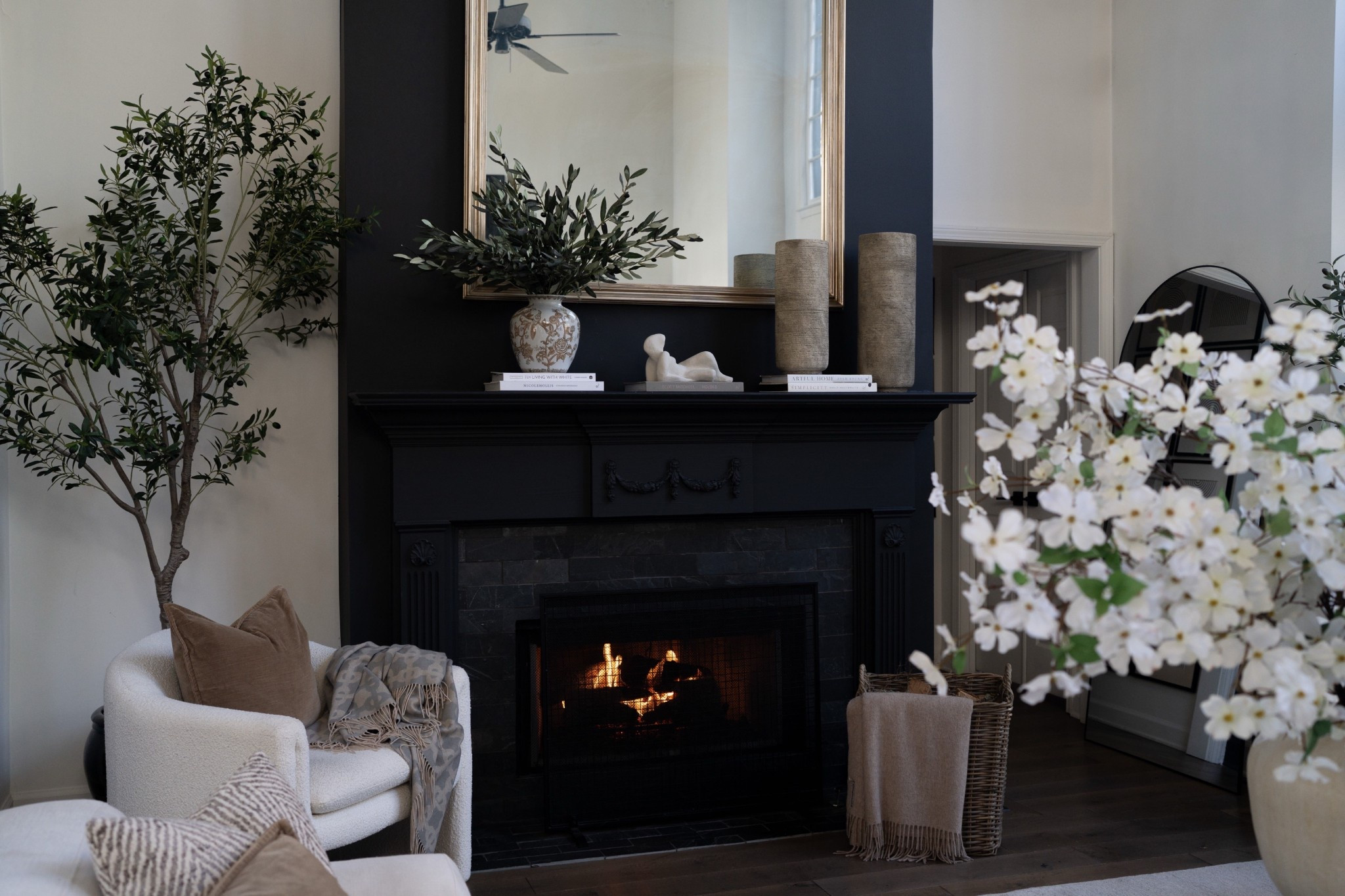 EEK I am completely obsessed with these olive stems and this beautiful patterned vase on my fireplace mantel. The greenery brings the perfect natural texture while the neutral ceramic vase adds such a timeless, elevated touch. It instantly makes the living room feel fresh, layered, and styled in that modern organic home decor style I love.

#LTKHome #LTKSeasonal #LTKSpringSale