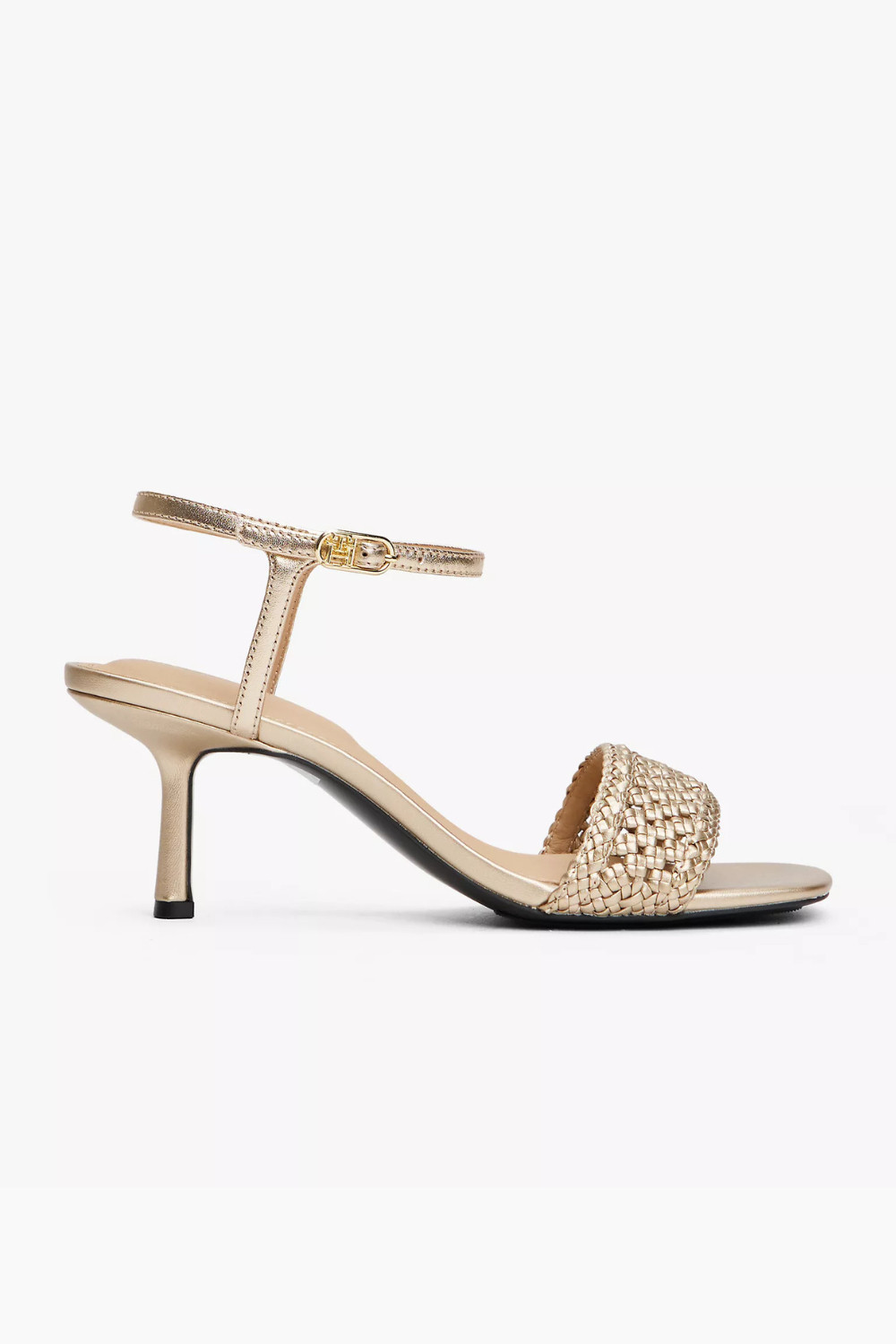 Shine at every event with this Tommy Hilfiger metallic kitten heel sandal. Designed with a sleek ankle strap, square toe, and woven toe strap, it brings a modern yet timeless touch to your evening look. The 2.5 inch heel offers elegant lift with all day comfort, making it perfect for parties, weddings, and night outs. The high shine finish adds a subtle glow to any outfit. Tap to shop this statement piece and elevate your look.

#TommyHilfiger #KittenHeel #EveningStyle #ChicOutfit 

 #LTKHoliday #LTKPetite #LTKShoeCrush