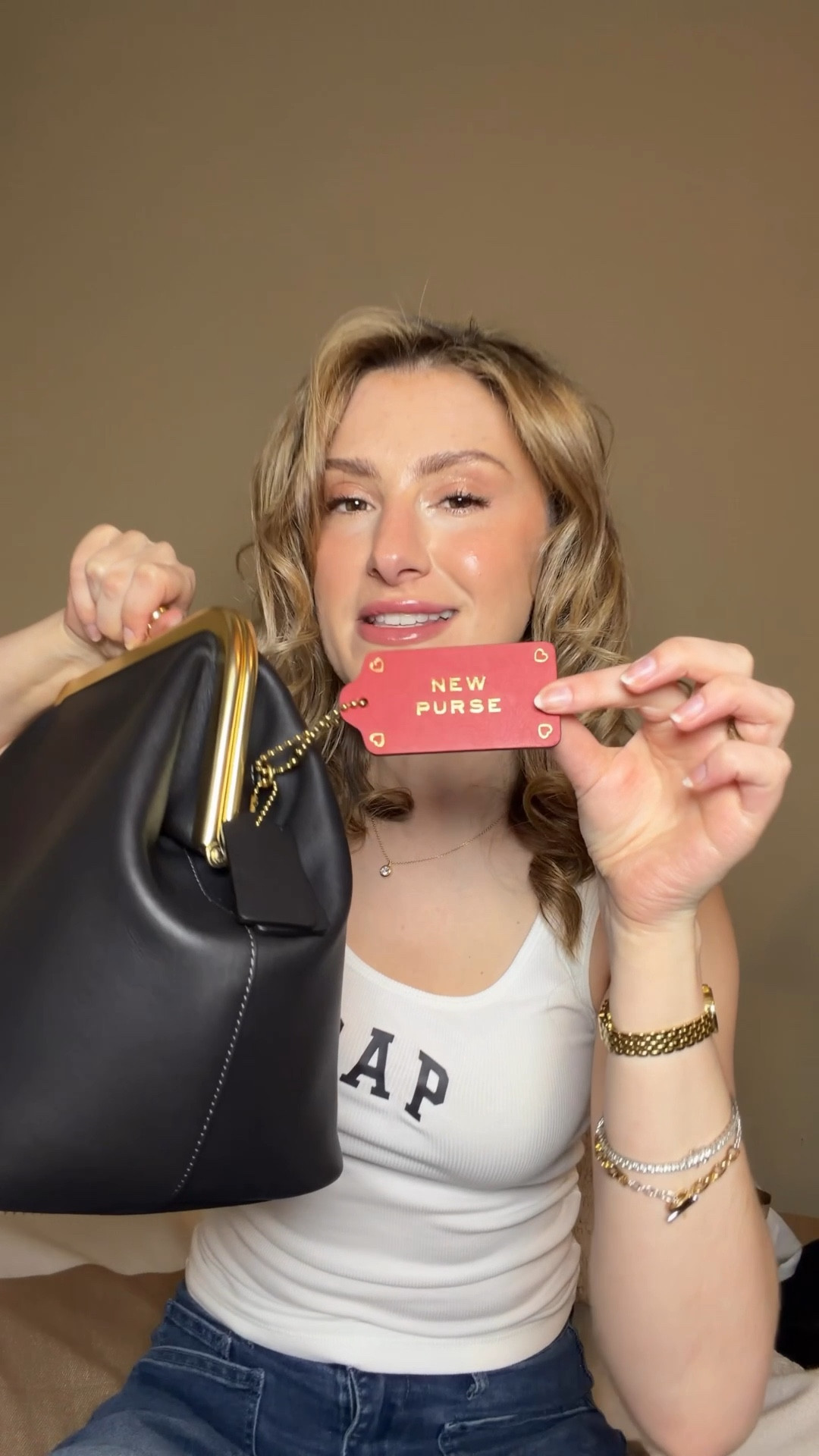 She’s been out of stock but she’s finally back 🖤 I just added a Coach Kisslock to my collection and she is worth the hype!

This is the Coach kisslock 27 which is the perfect size. Not too big and not too small and unlike her little sister, her shoulder strap is detachable so you can customize how you carry her with different types of straps like crossbody, shoulder, or strapless like a clutch. 

I got it in black because I love how Carolyn bessette Kennedy wore big black bags year round even with sun dresses. Such a vibe! ☀️🖤

#LTKgrwm #LTKdayinmylife #LTKootd