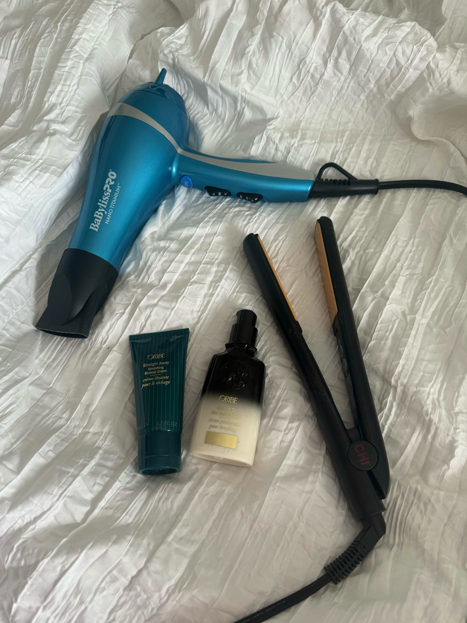 curly➡️straight products i NEED 
oribe blowout cream 
oribe heat styling shield 
babybliss pro nano titanium blow dryer 
chi flat iron 