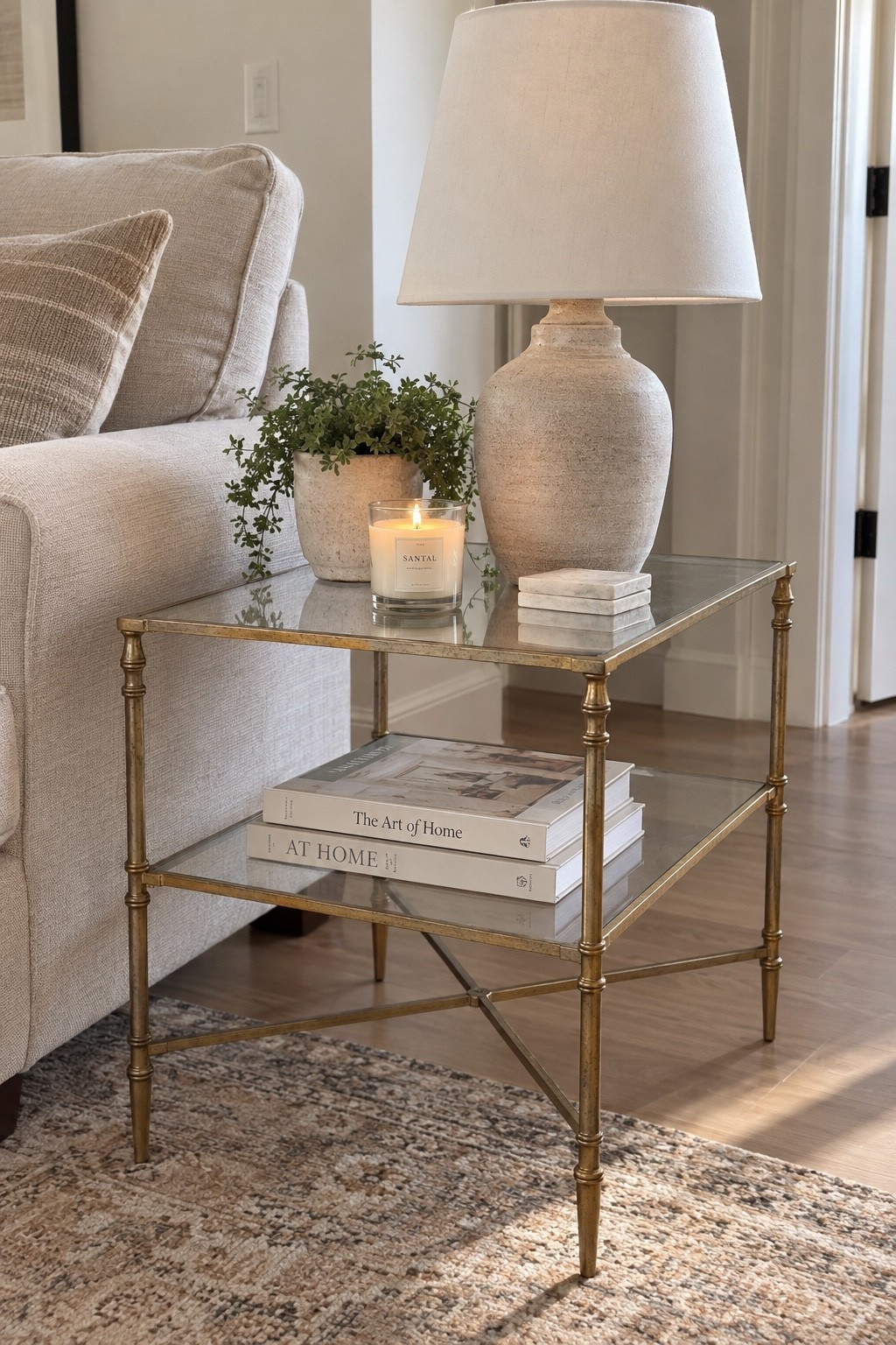 This little side table is such a pretty way to add warmth and character to a living room. I love the antique brass finish, the glass shelves, and how easy it is to style with a lamp, books, and a few simple decor pieces. ✨ #ad #wayfair #wayfairpartner @Wayfair
