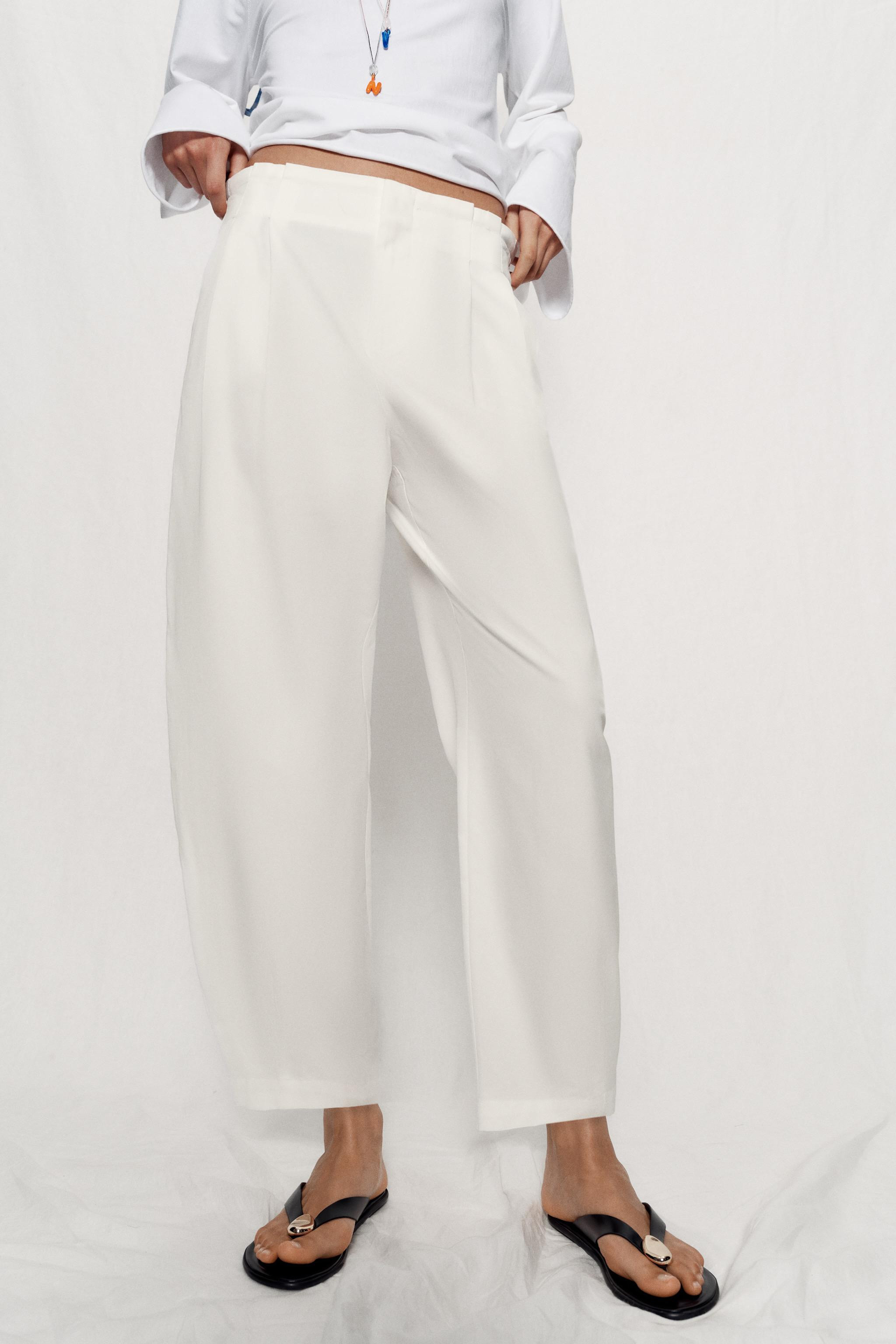 Model height: 183 cmMid-waist trousers with front darts and an elasticated back waistband. Front ... | Zara UK