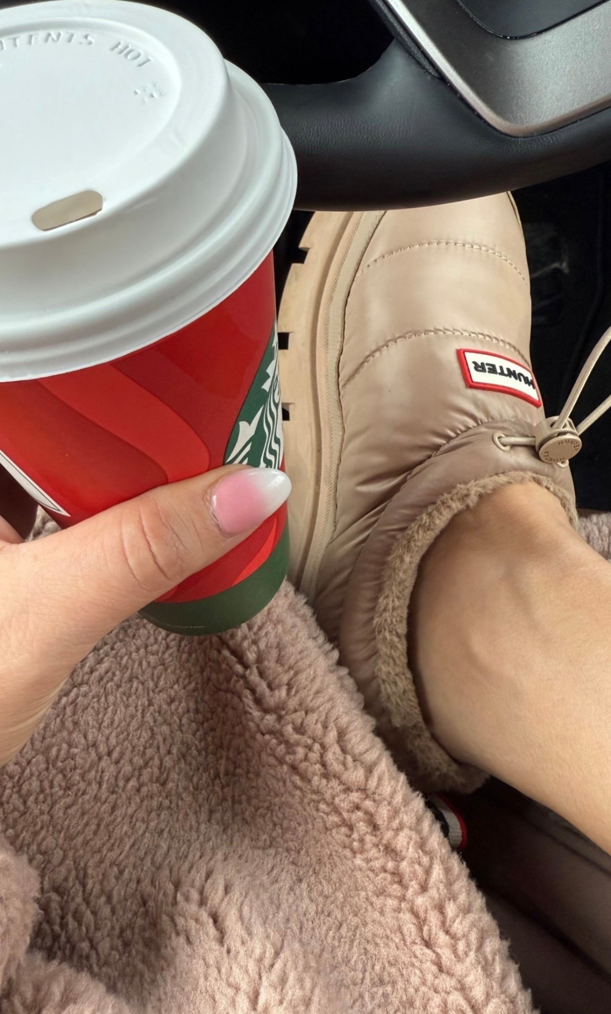 If you are a cold weather girl, this is exactly what you need. Warm, cute, comfortable, and waterproof Hunter shoes! 
They run big so if between, size down 