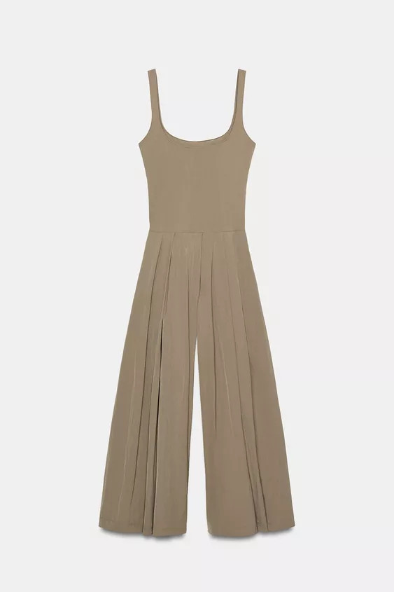 Round neck jumpsuit with straps. In-seam side pockets. Wide leg with pleat detail. Side fastening... | Zara UK