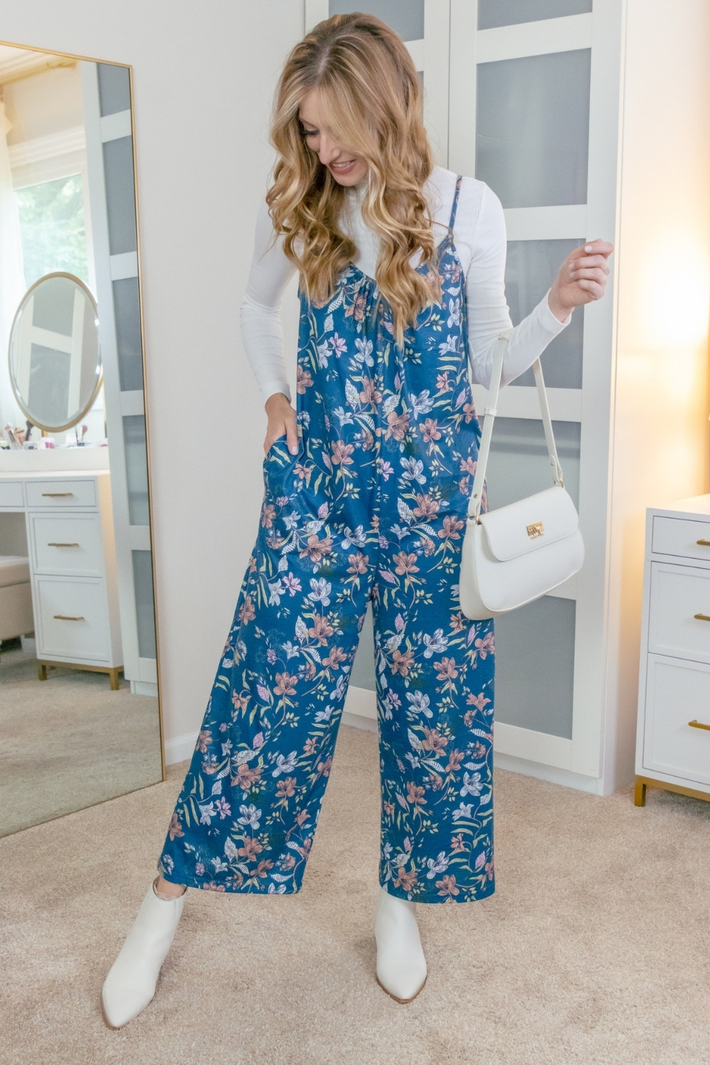 I'm loving this comfy floral jumpsuit! It's so easy to transition from season to season. Pair it with a cute bootie and long sleeve top for the perfect cool weather look. 
>> I'm in a size small in the romper and the turtleneck. 
Check out my storefront for more affordable fashion finds! 
 

 #LTKootd #LTKSeasonal #LTKOver40