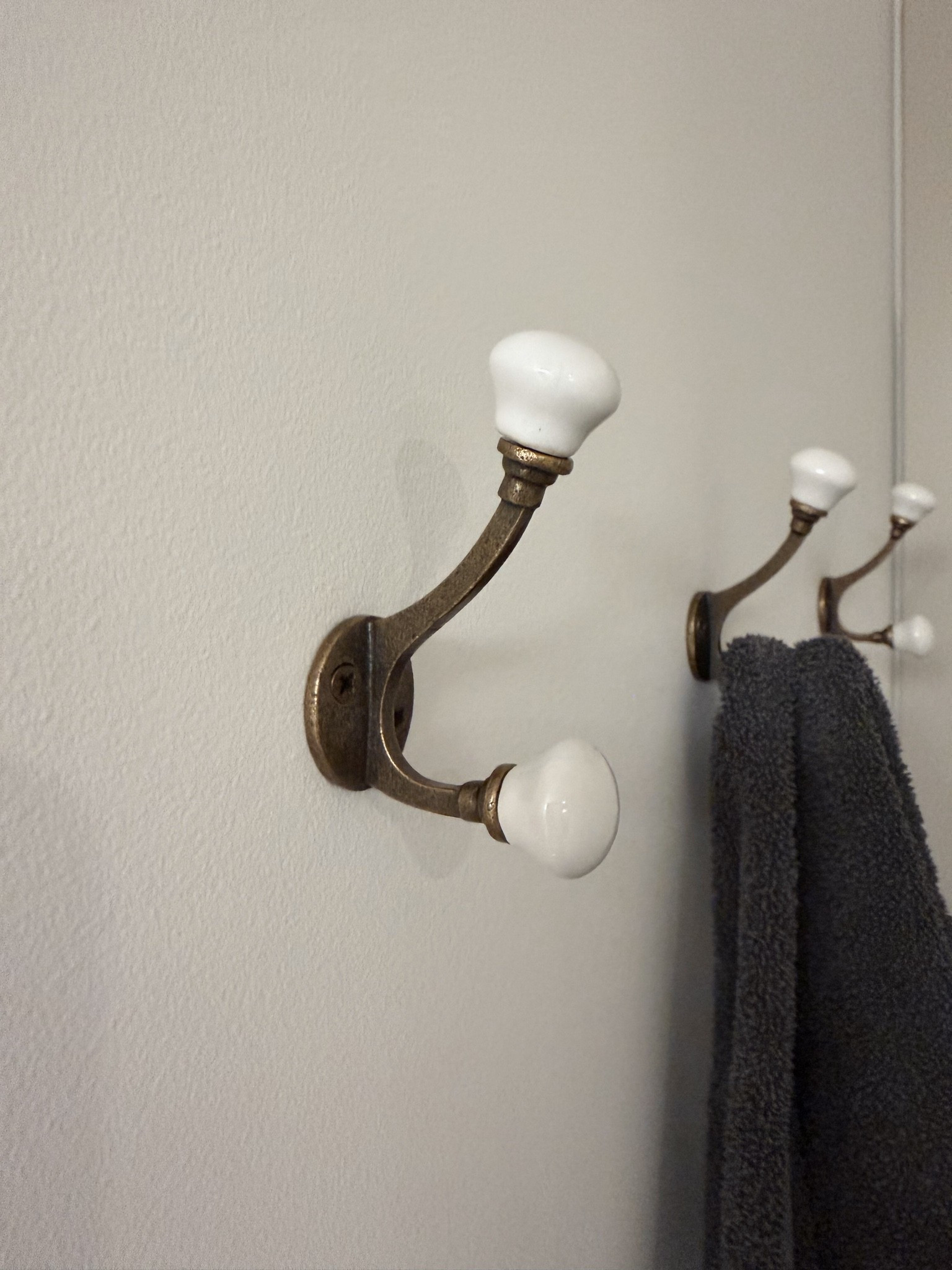 We've lived in this house for 10 years, and I finally got around to adding hooks in our bathroom. 😂 Sometimes it's the smallest updates that make the biggest difference. These ceramic hooks are only $13, but they have that elevated, modern organic look that makes a space feel more custom and thoughtfully designed. I've been using them for towels, robes, and pajamas, and they instantly made the bathroom feel more functional and finished. Such an easy and affordable upgrade that looks far more expensive than it is. Linked here.

#LTKhome #LTKsale